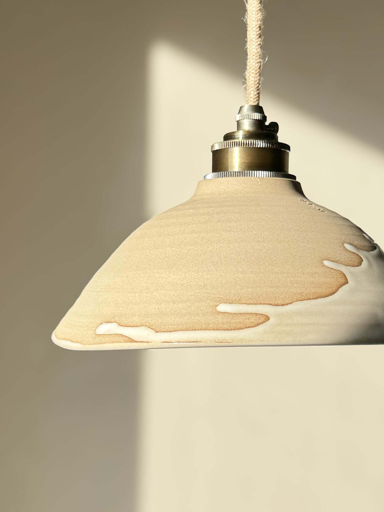 Ceramic Lamp Shade – Yuki #02, featuring a slanted raw clay design with creamy glaze drip and glossy white interior, perfect for soft lighting.