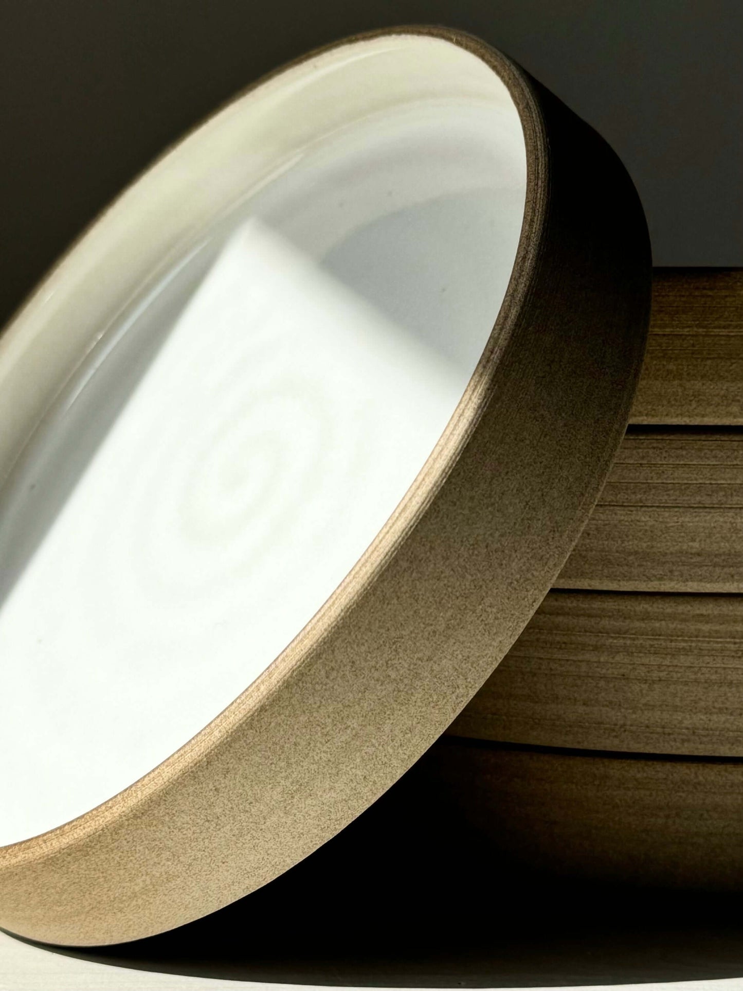 Ceramic Plate from Yuki Series with glossy white glaze and toffee-colored clay, designed for calm moments and soft light.