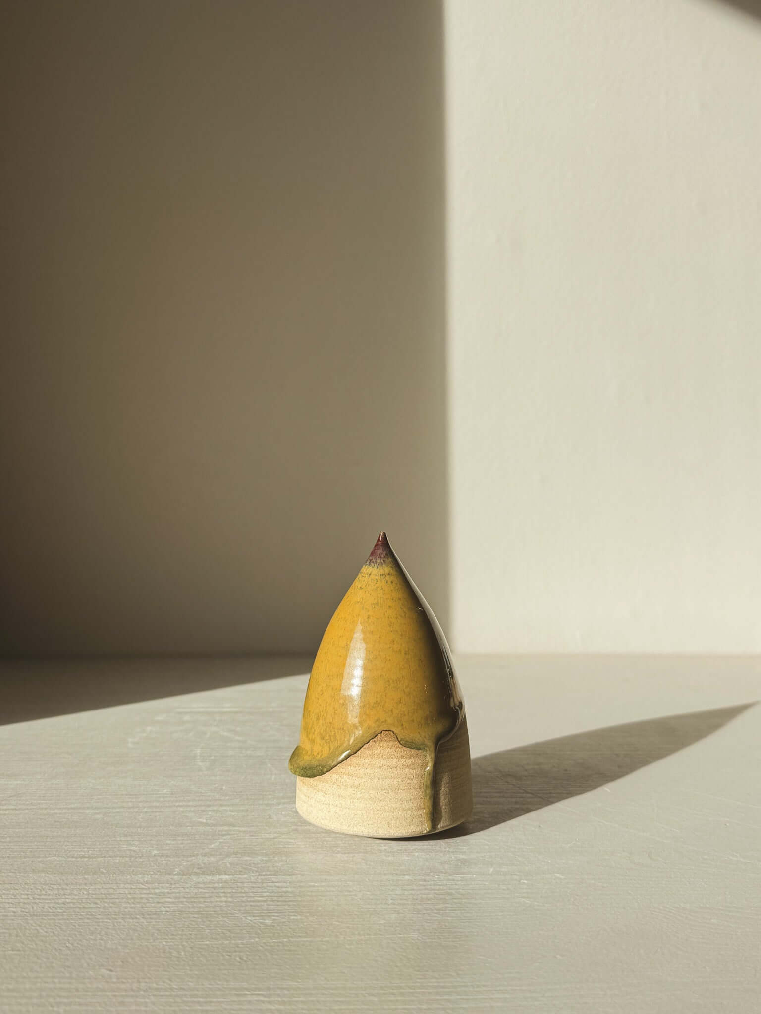 Minimalist Ceramic Christmas Tree – Inyo #03 with Tenmoku glaze in warm tones.
