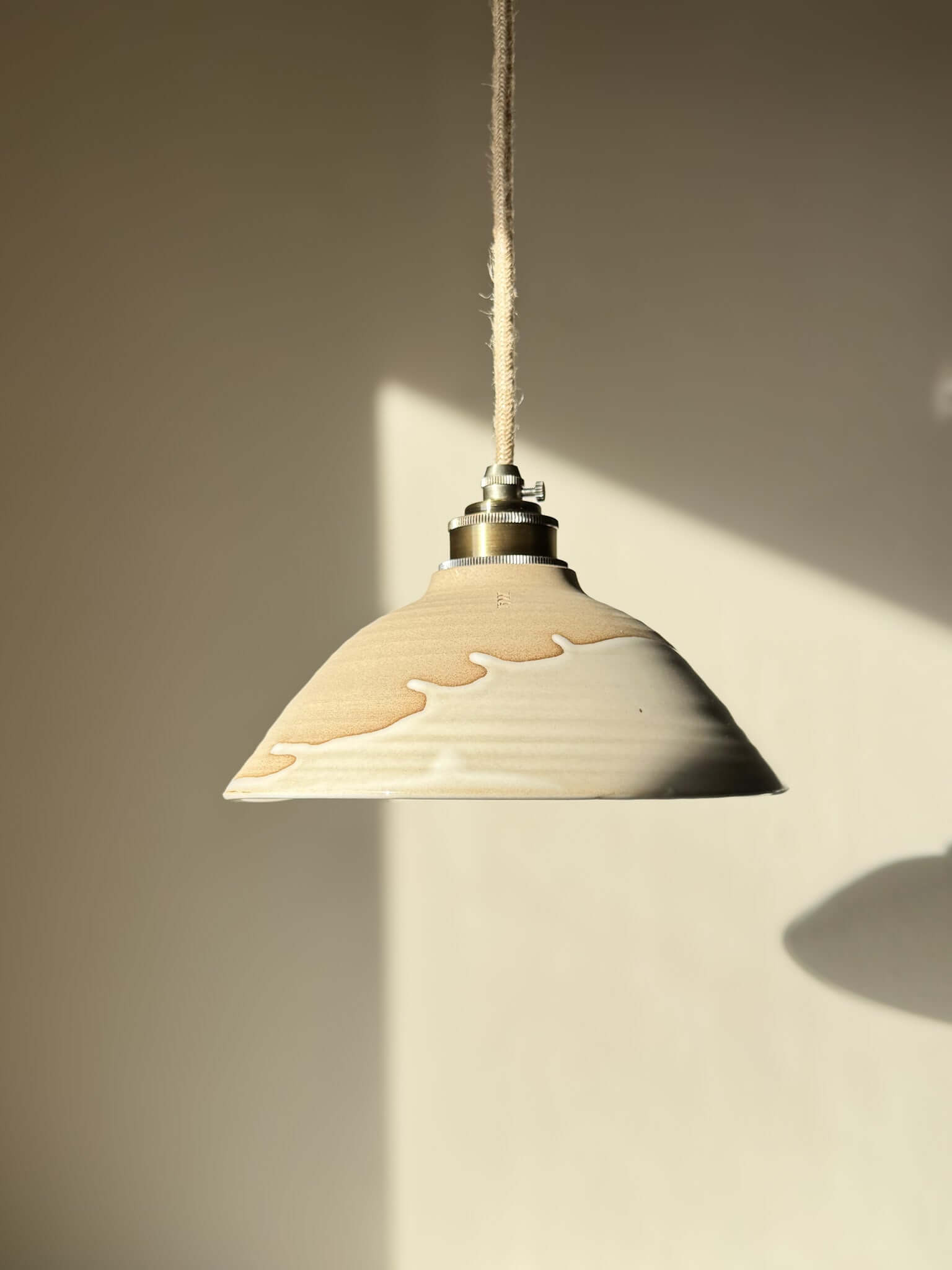 Ceramic Lamp Shade – Yuki #02 with glossy white glaze and warm raw clay design, featuring a creamy drip and organic slanted profile.