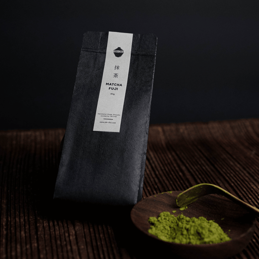 Ceremonial Matcha Powder in 40g Fuji Matcha bag on dark wooden surface