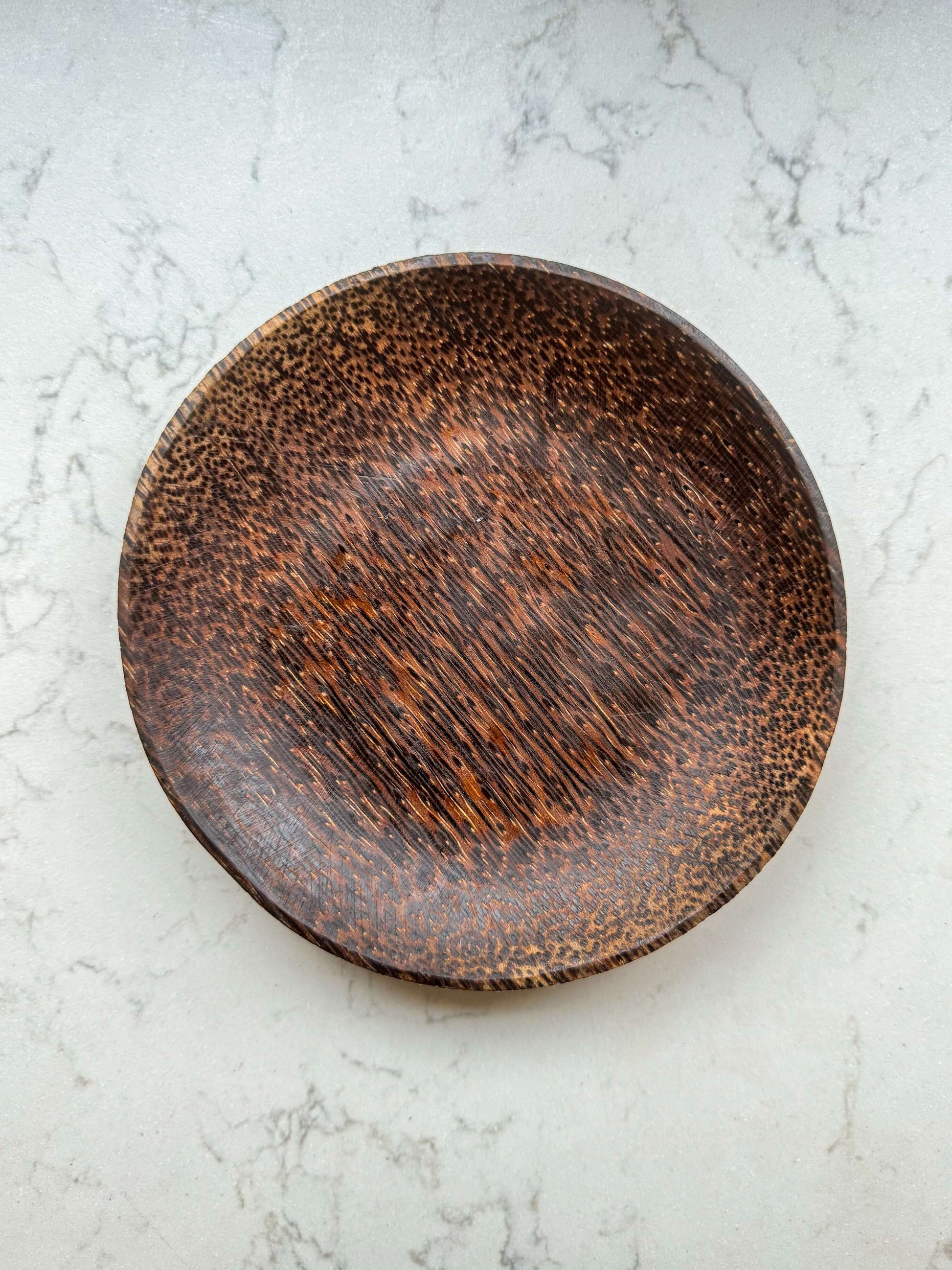 Coconut Wood Side Plate with unique grain pattern, handcrafted in Marrakech, perfect for adding natural warmth to dining settings.