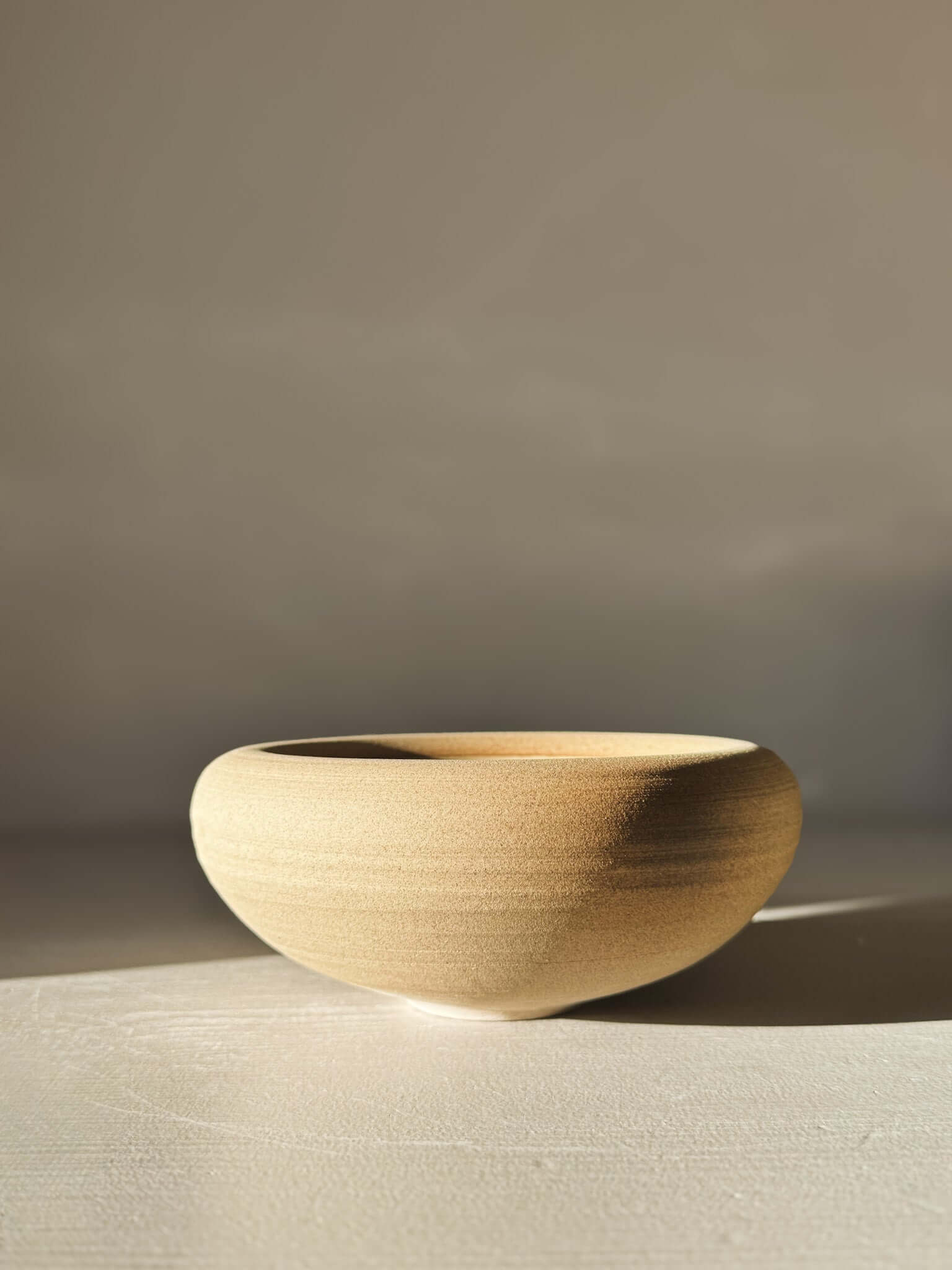 Double-Walled Bowl - Inyo #01 with raw toffee-toned clay exterior, perfect for modern table settings.
