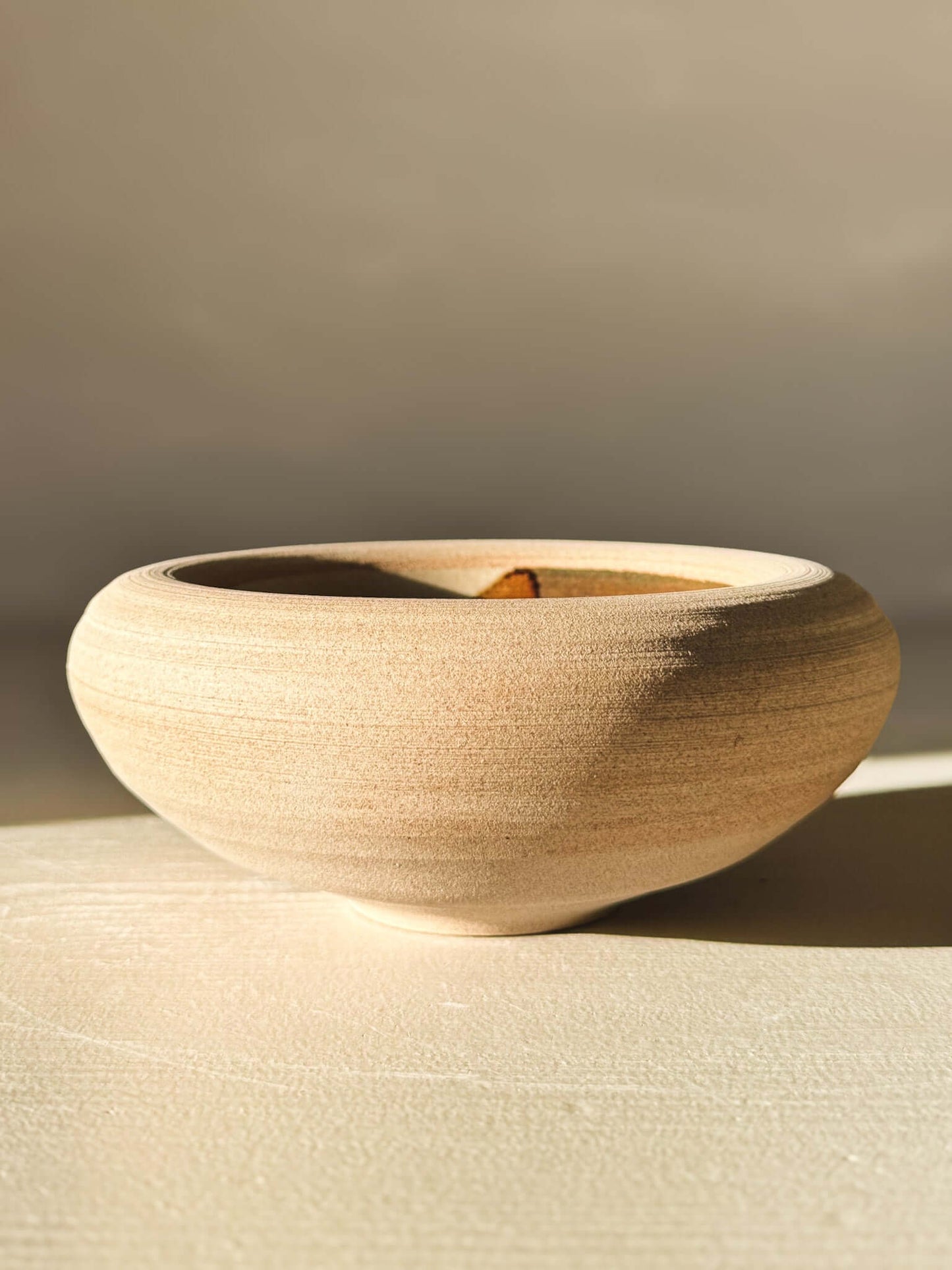 Double-Walled Bowl - Inyo #02 with raw toffee-toned clay and clear tenmoku glaze in browns and blues.