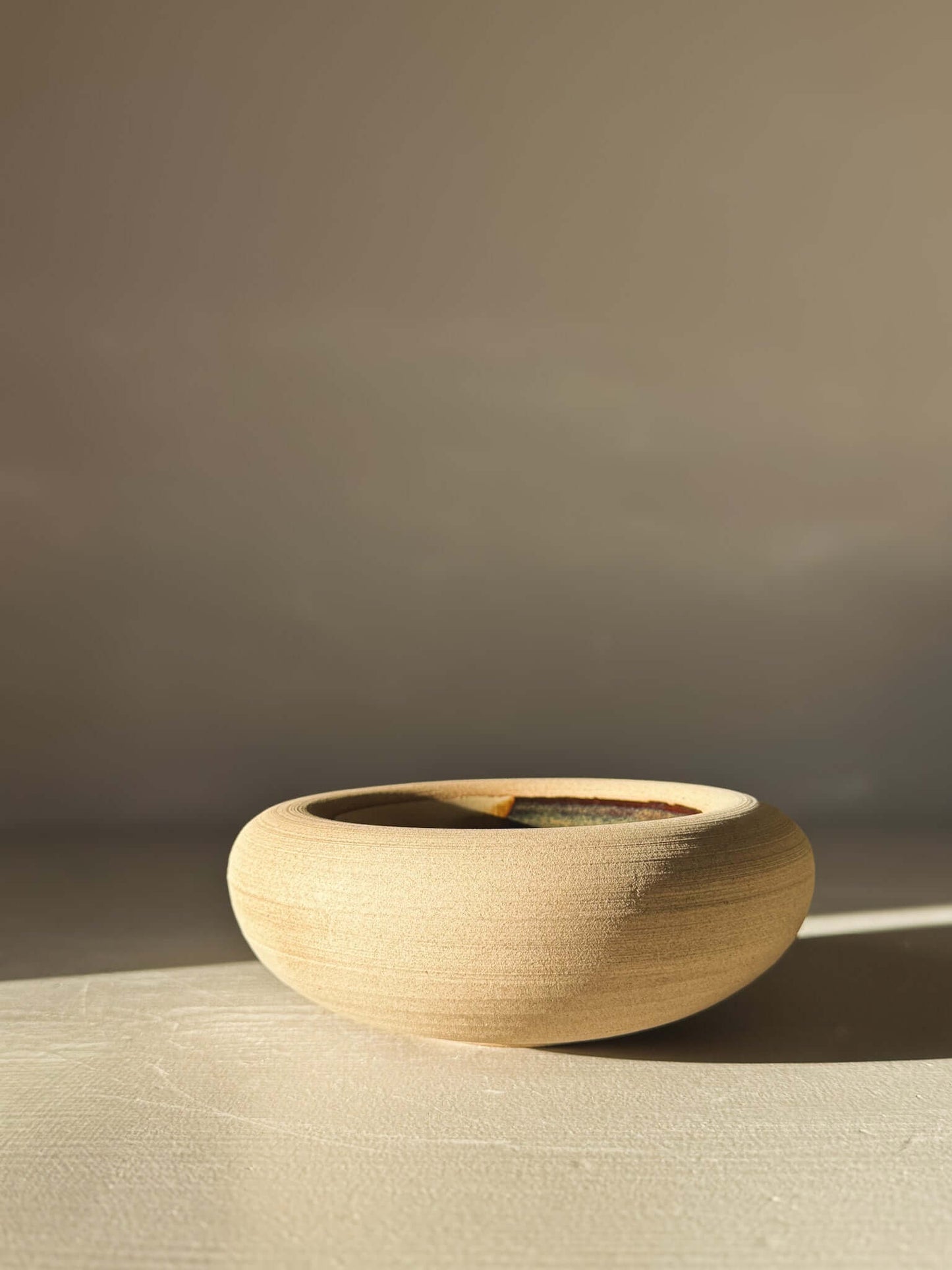 Double-Walled Bowl - Inyo #03 displayed with a soft, rounded exterior in raw toffee-toned clay, featuring gentle throwing lines.