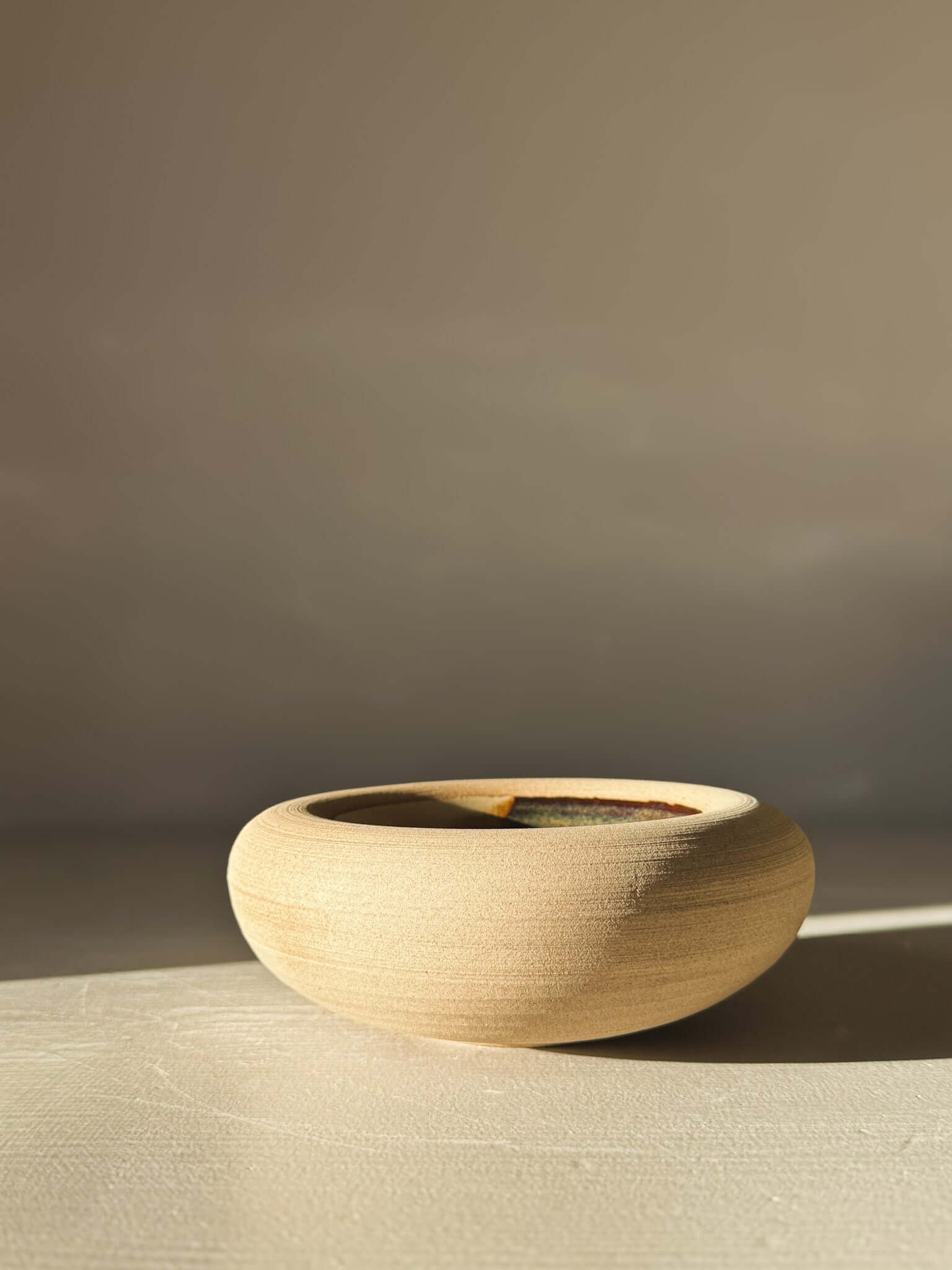 Double-Walled Bowl - Inyo #03 displayed with a soft, rounded exterior in raw toffee-toned clay, featuring gentle throwing lines.