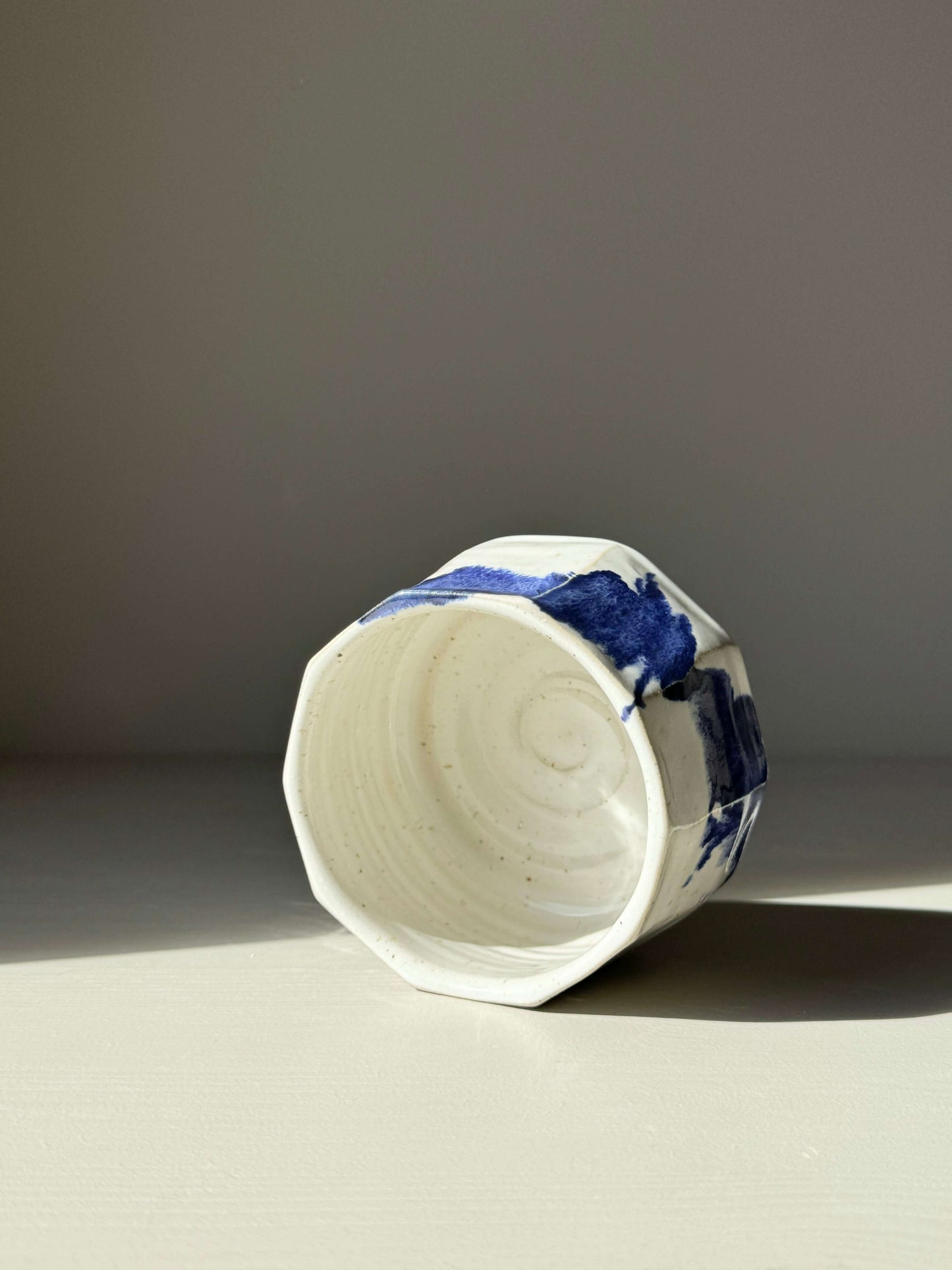 Faceted Matcha Bowl in Glossy White with Cobalt Blue Accents, showing unique texture and modern design.