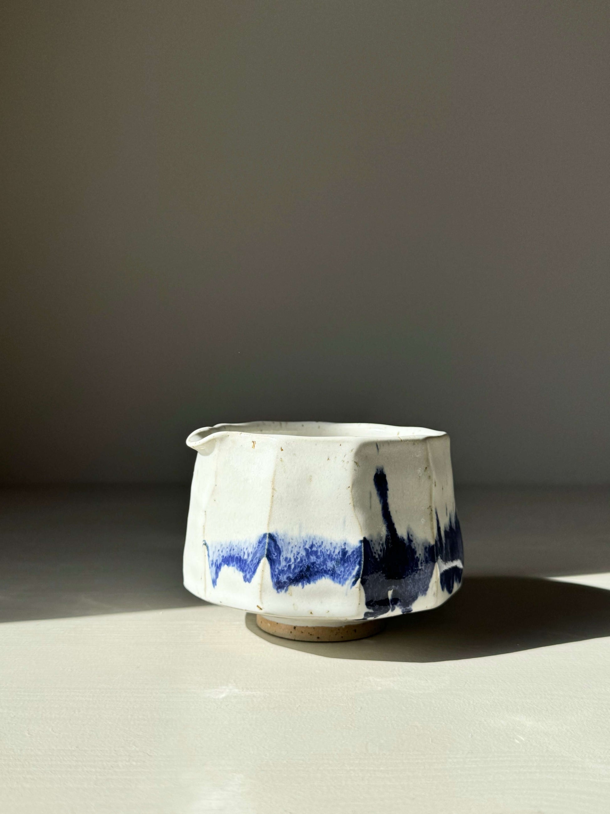 Faceted Matcha Bowl with Spout featuring cobalt blue and glossy white glaze, modern and textured design, product number 03.