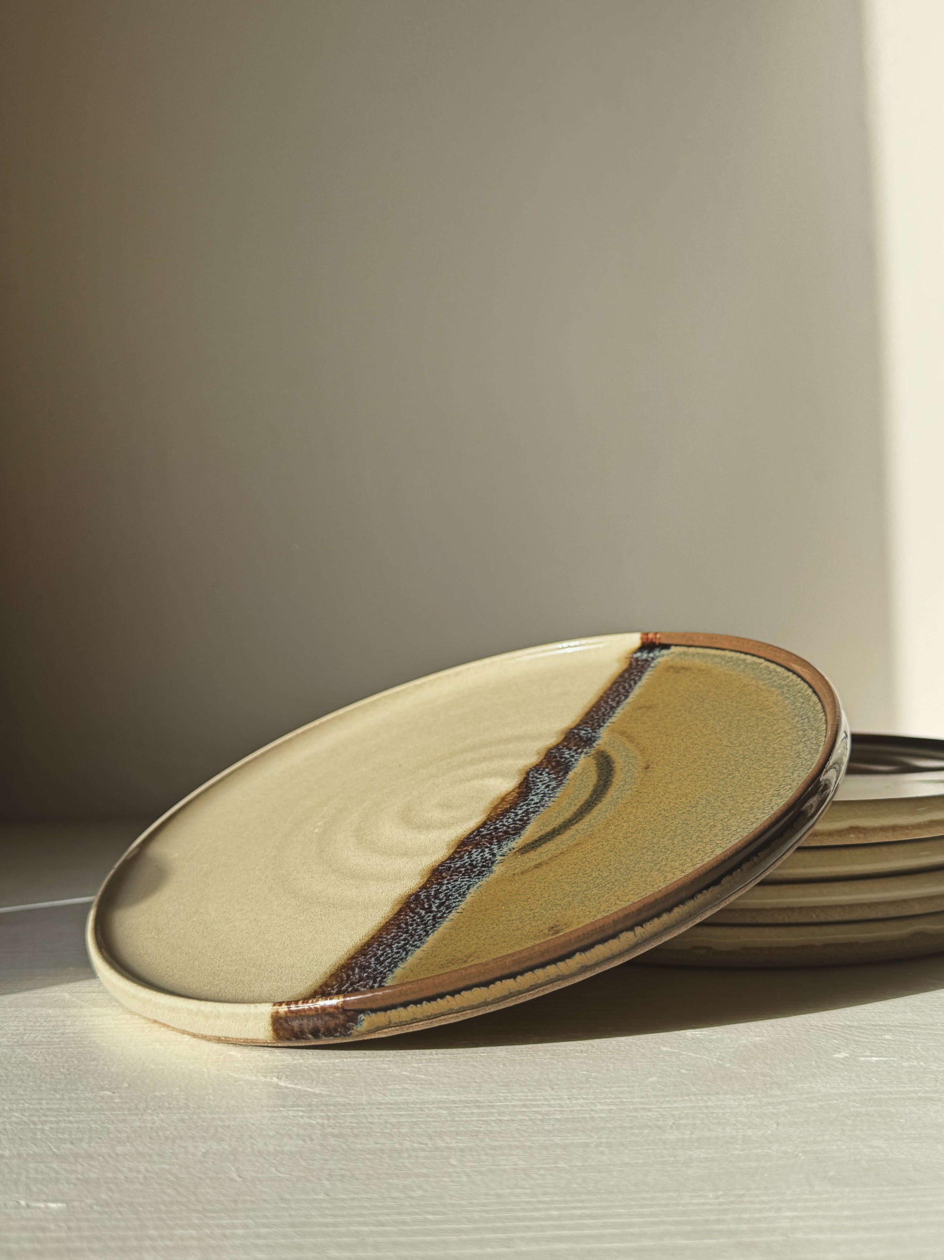 Flat Round Breakfast Plate – Inyo with tenmoku and clear glaze design