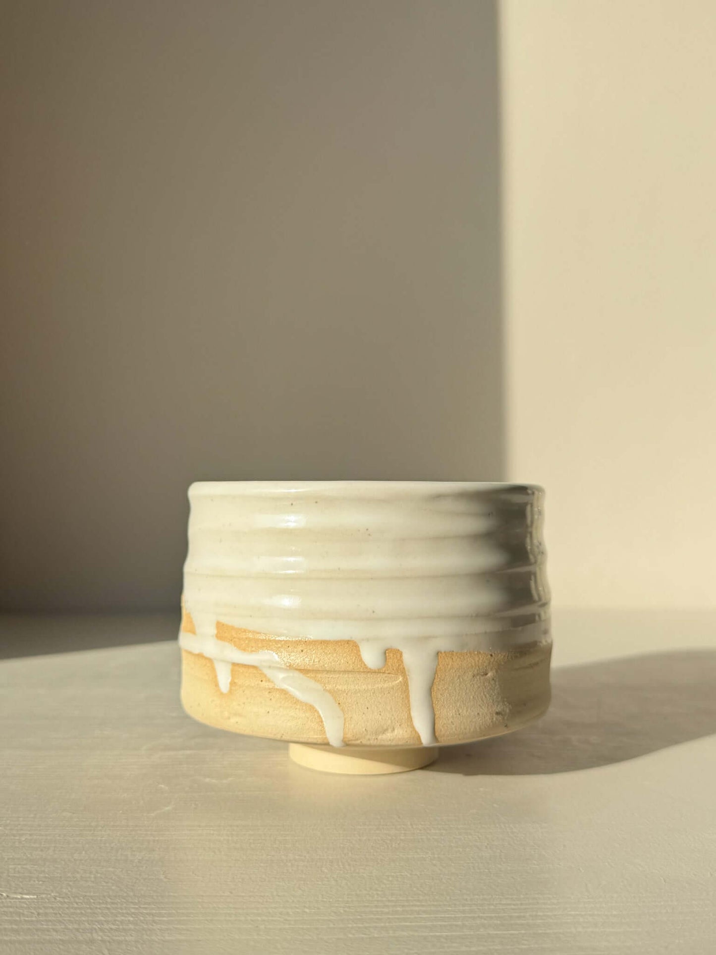 Matcha Bowl – Glossy White #04 with speckled clay, glossy glaze, and textured surface showing wheel markings.