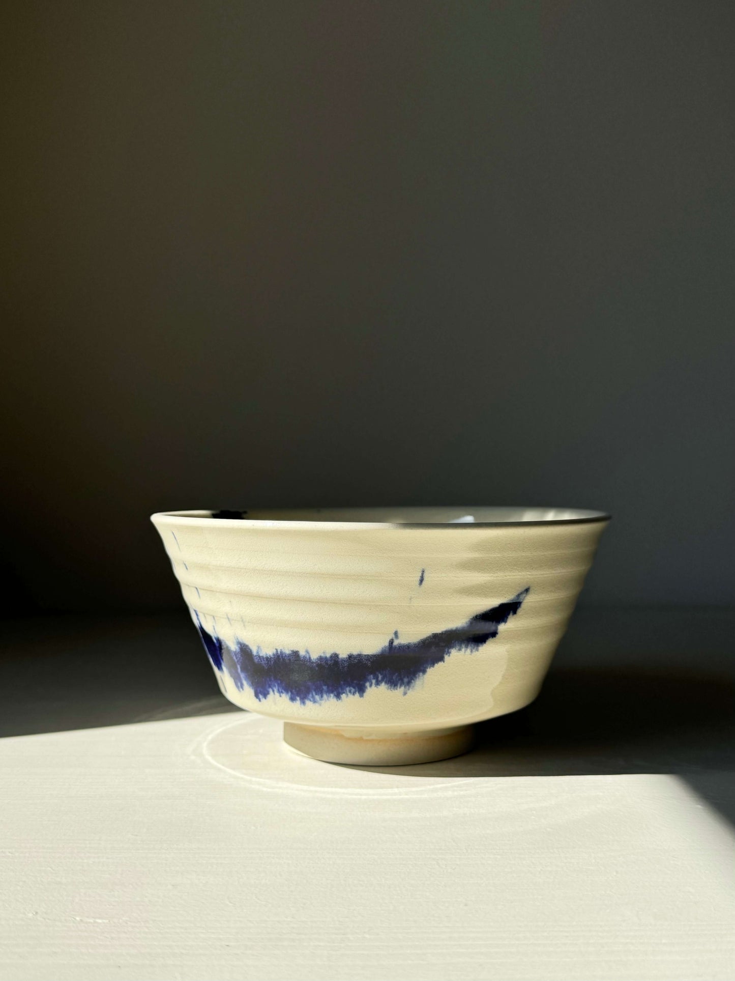 Gosu Series ramen bowl with cobalt blue splashes on natural clay, perfect for ramen or soups. Handcrafted artisan design.