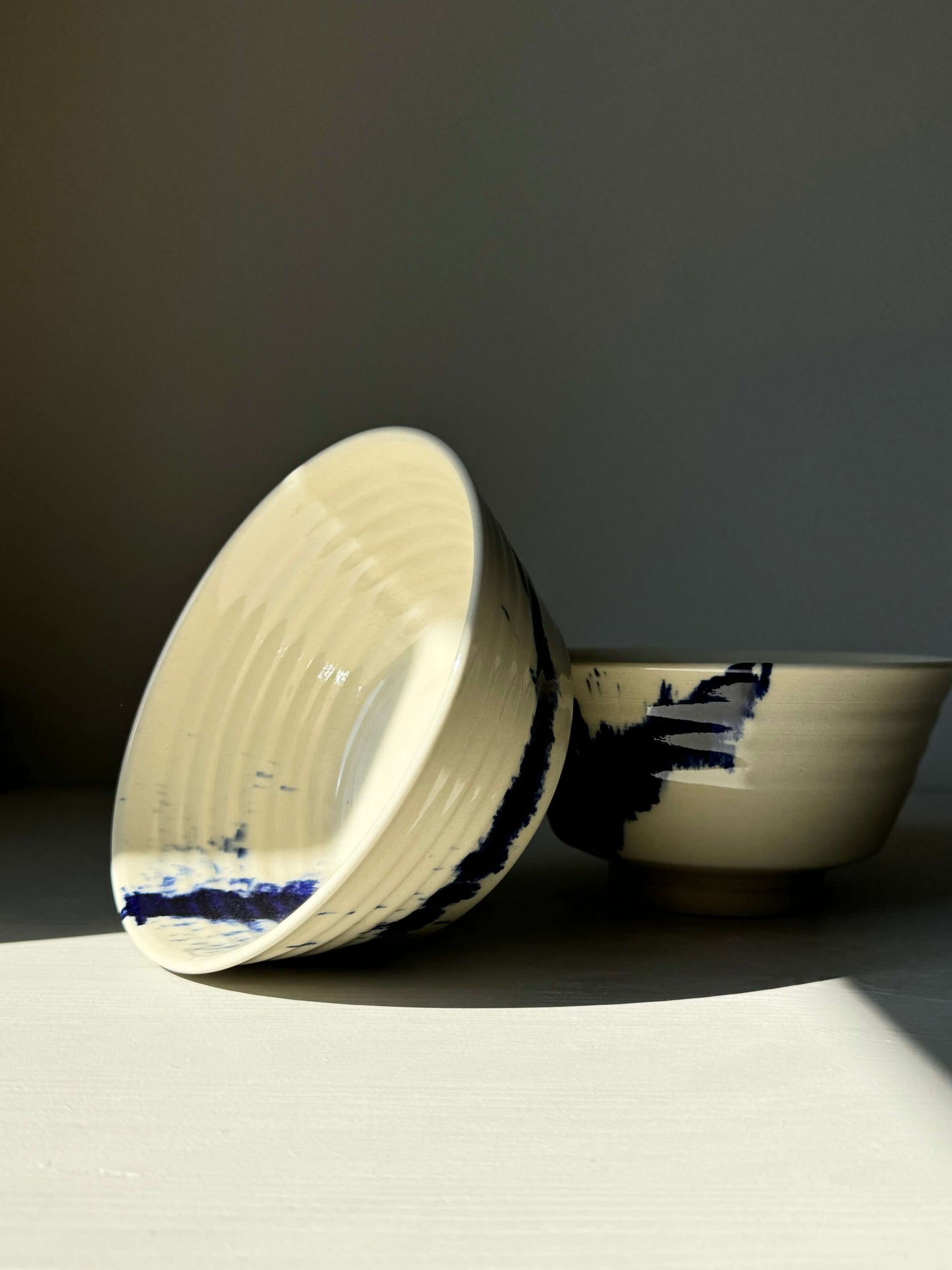 Handcrafted Gosu Series ramen bowl with bold cobalt blue splashes and clear glaze, perfect for noodles and soups.
