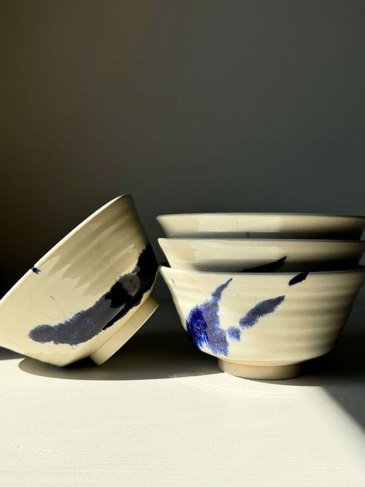 Handcrafted Gosu Series rice bowls with cobalt blue splashes, showcasing unique design and smooth clear glaze, ideal for rice and side dishes.