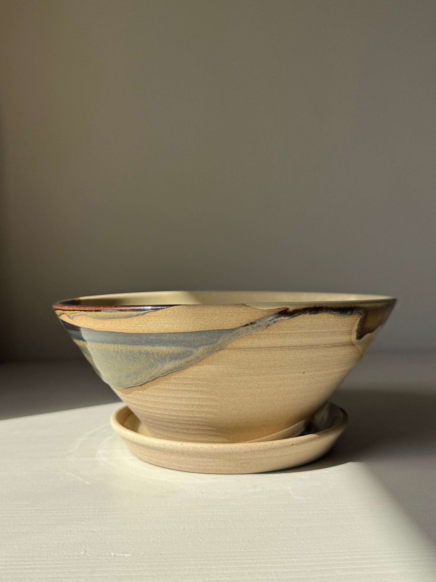 Handmade ceramic Berry Bowl - Inyo Series with tenmoku brown glaze and drip plate for rinsing fresh fruit.