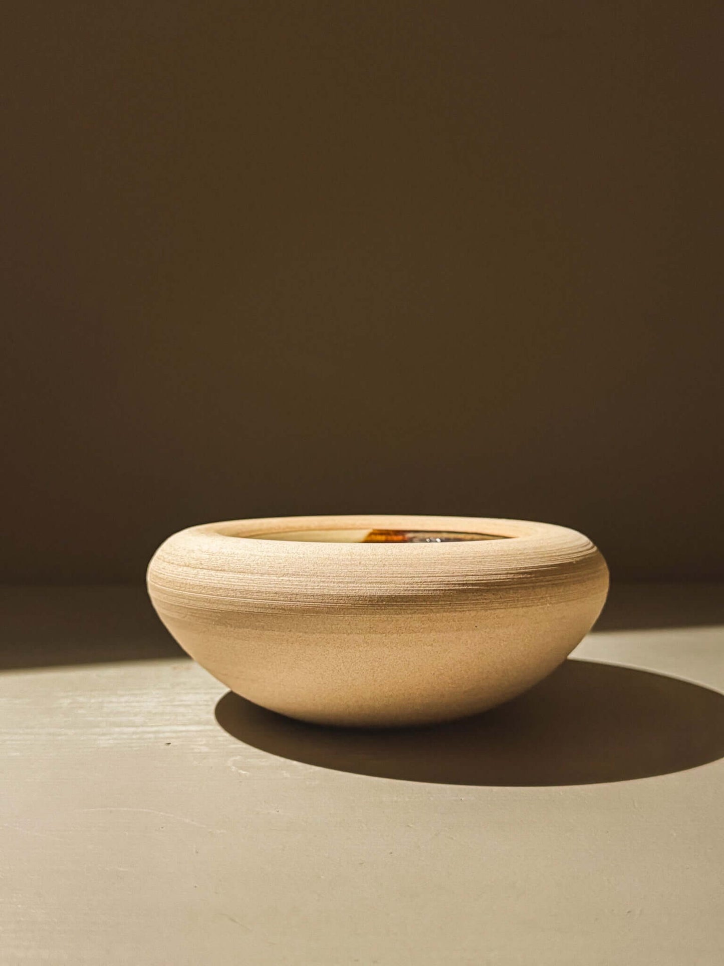 Handmade double-walled stoneware bowl in toffee-toned clay with unique glaze inside, from the Inyo Series. Perfect for elegant dining.