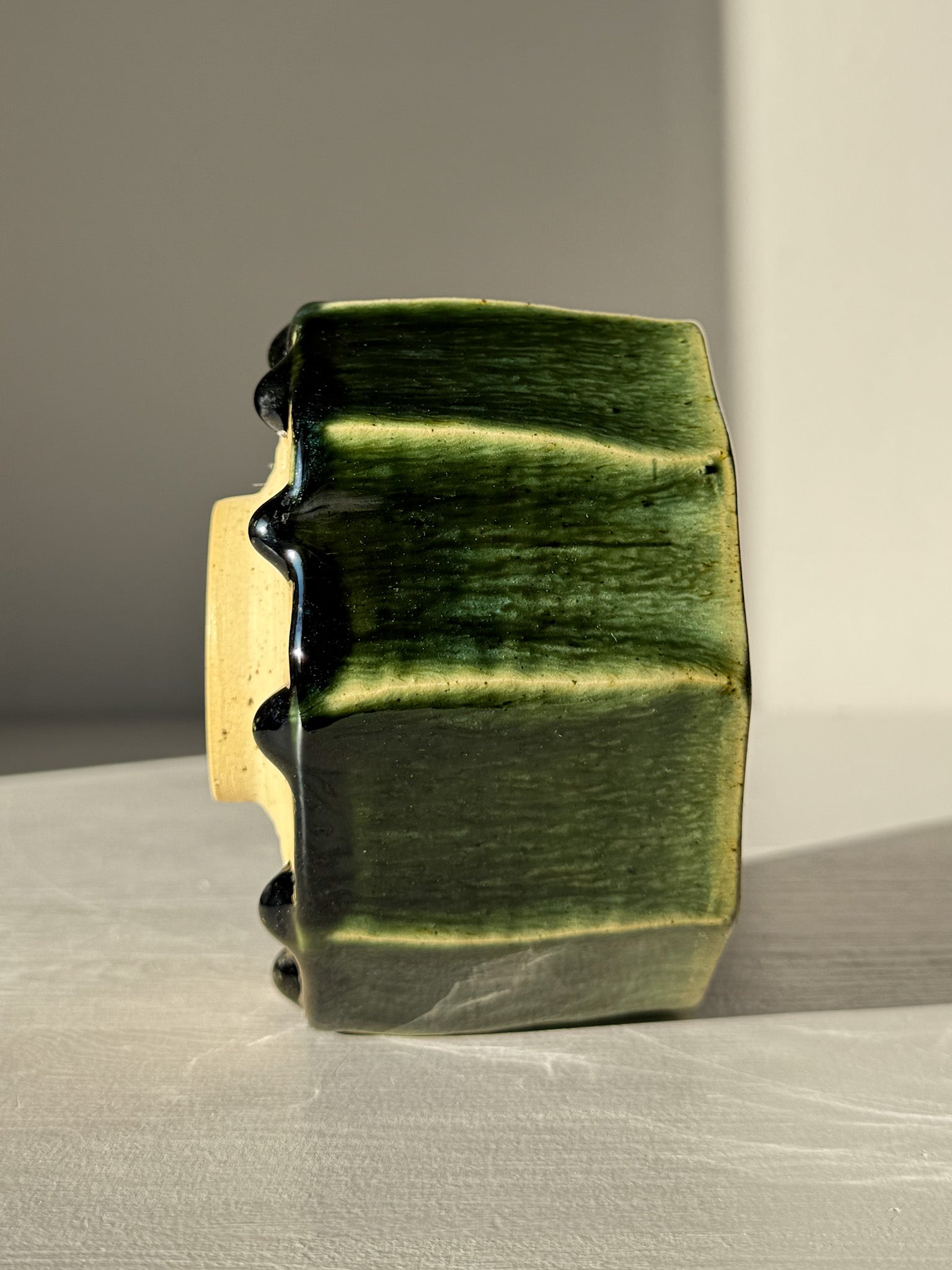 Faceted Matcha Bowl - Hinoki #01 with deep green glaze drips and hand-carved facets, showcasing unique kiln effects and elegant shape.