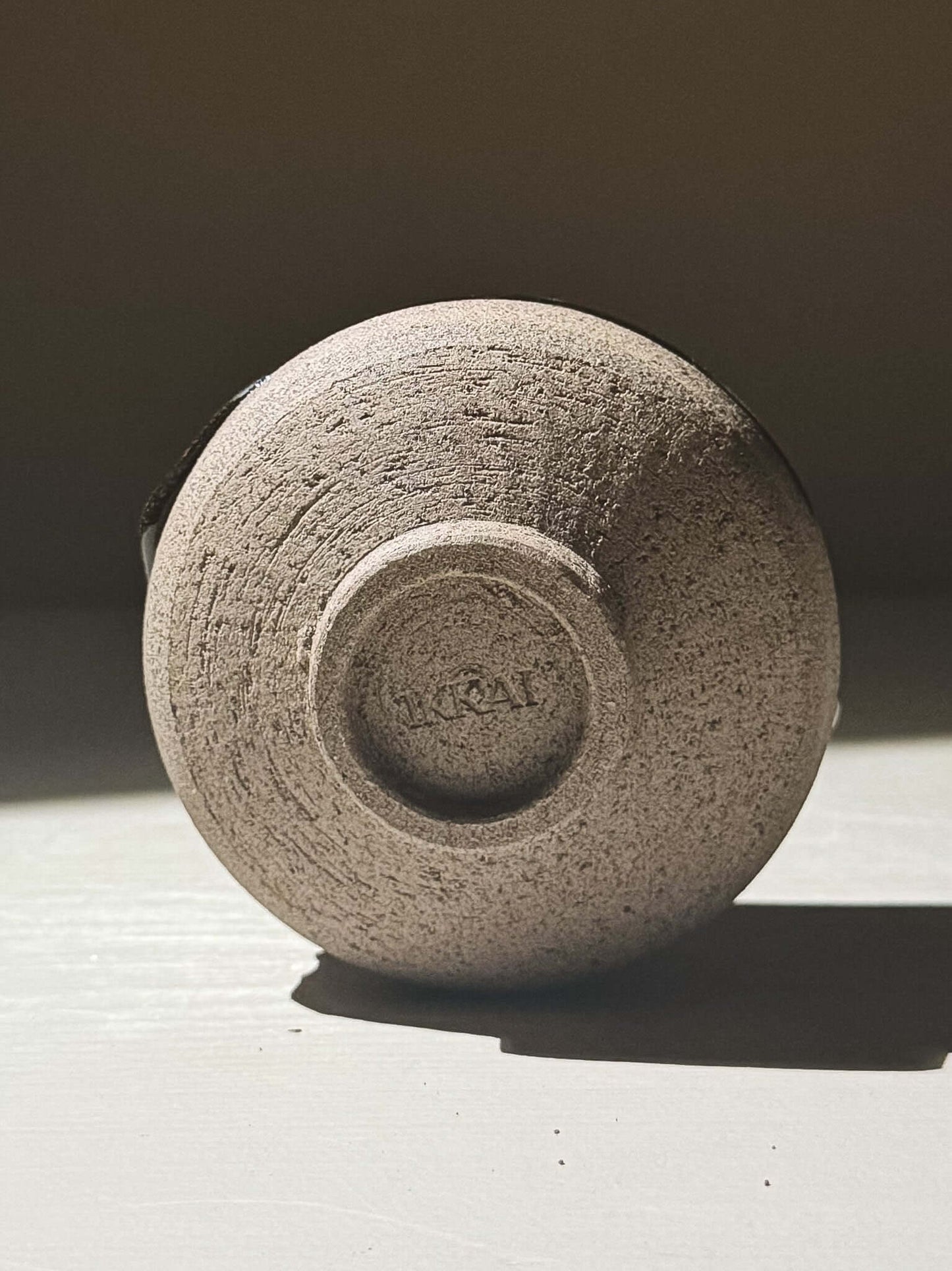 Bottom view of Yunomi Cup - Kuro Ash #03 showcasing its texture and craftsmanship.