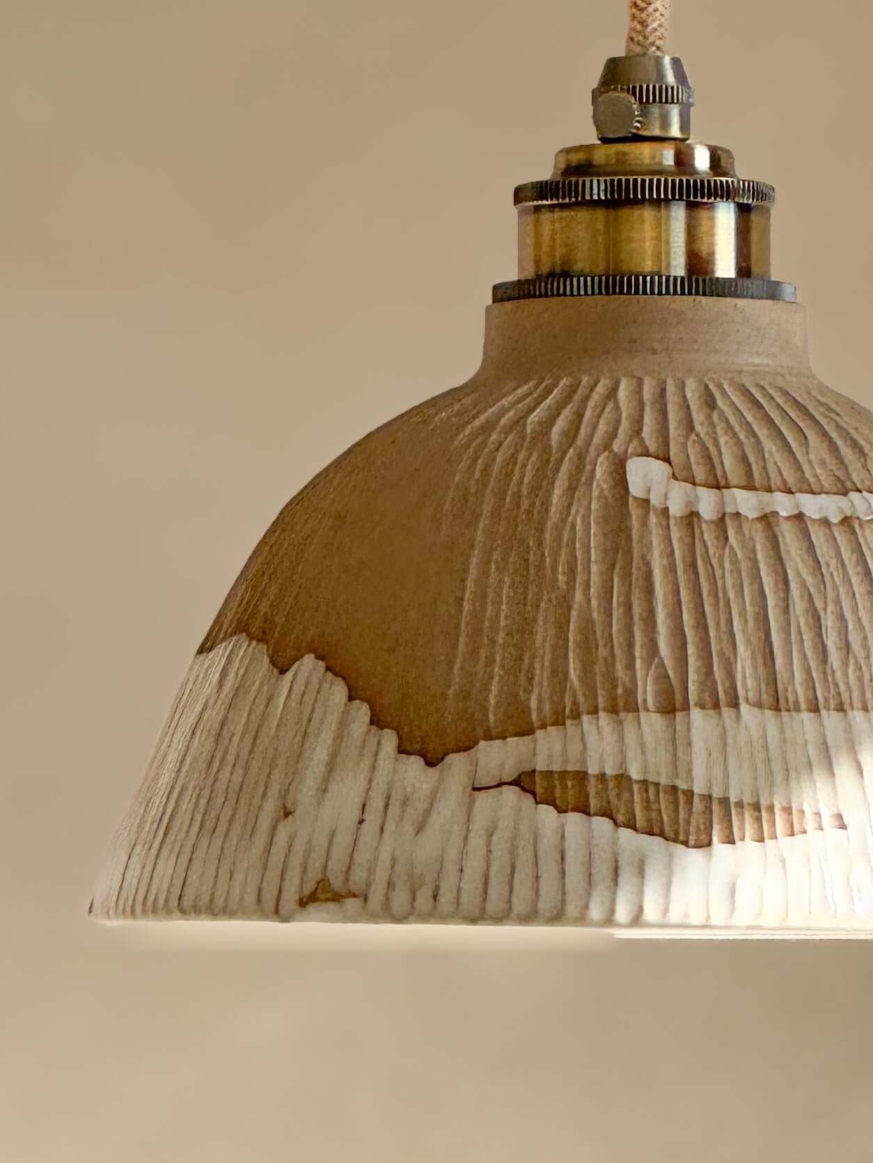 Handmade Ceramic Lamp Shade – Yuki Series with carved ridges and white glaze, showcasing a blend of matte and glossy surfaces.
