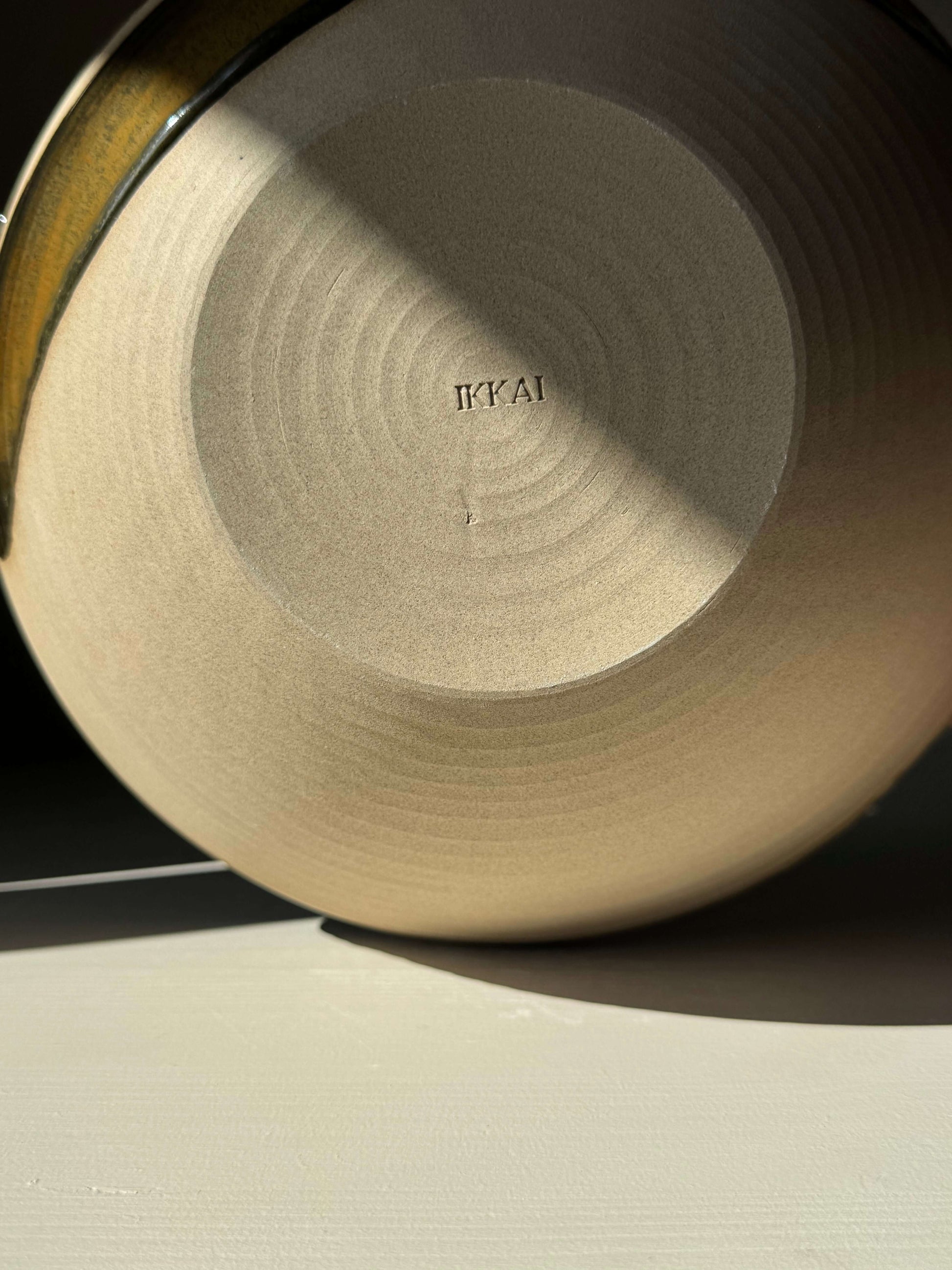 Base of handmade ceramic Large Bowl - Inyo Series #01, showing craftsmanship details and glaze finish.