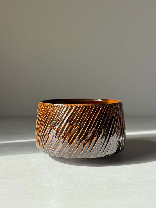 Handmade ceramic Matcha Bowl – Kinsei #04 with glossy brown exterior and golden-orange interior, 7cm x 11cm, unique and luminous.