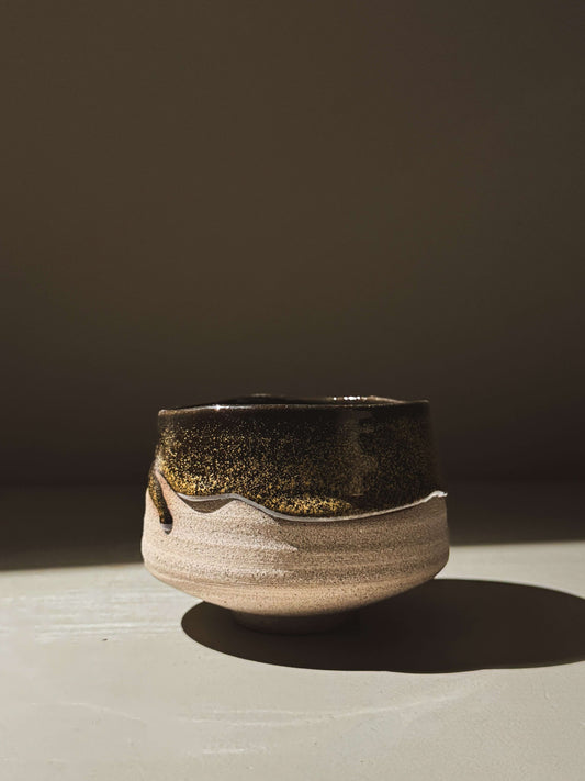 Matcha Bowl – Kuro Ash #02 handcrafted with ash-grey stoneware and glossy black glaze, showcasing elegant curves and natural glazing.