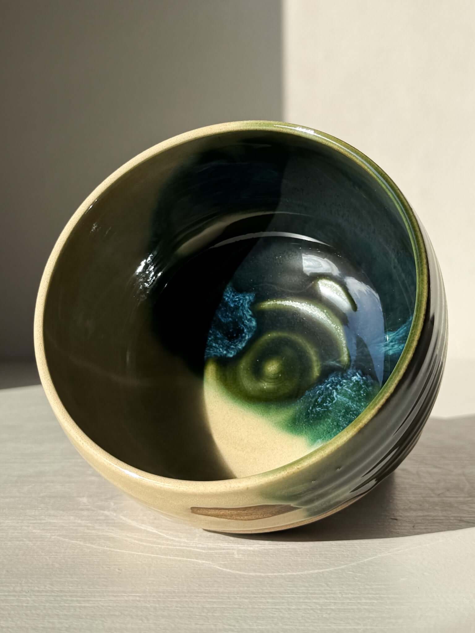 Handmade ceramic Matcha Bowl – Mori #04 with green and brown glazes, showcasing natural stoneware and organic design.