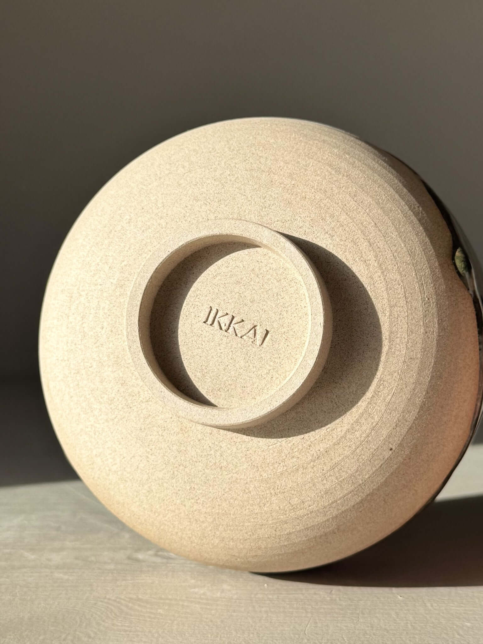 Base view of handmade ceramic Matcha Bowl with Spout – Inyo #05 from the Inyo Series, showcasing unique craftsmanship and design.