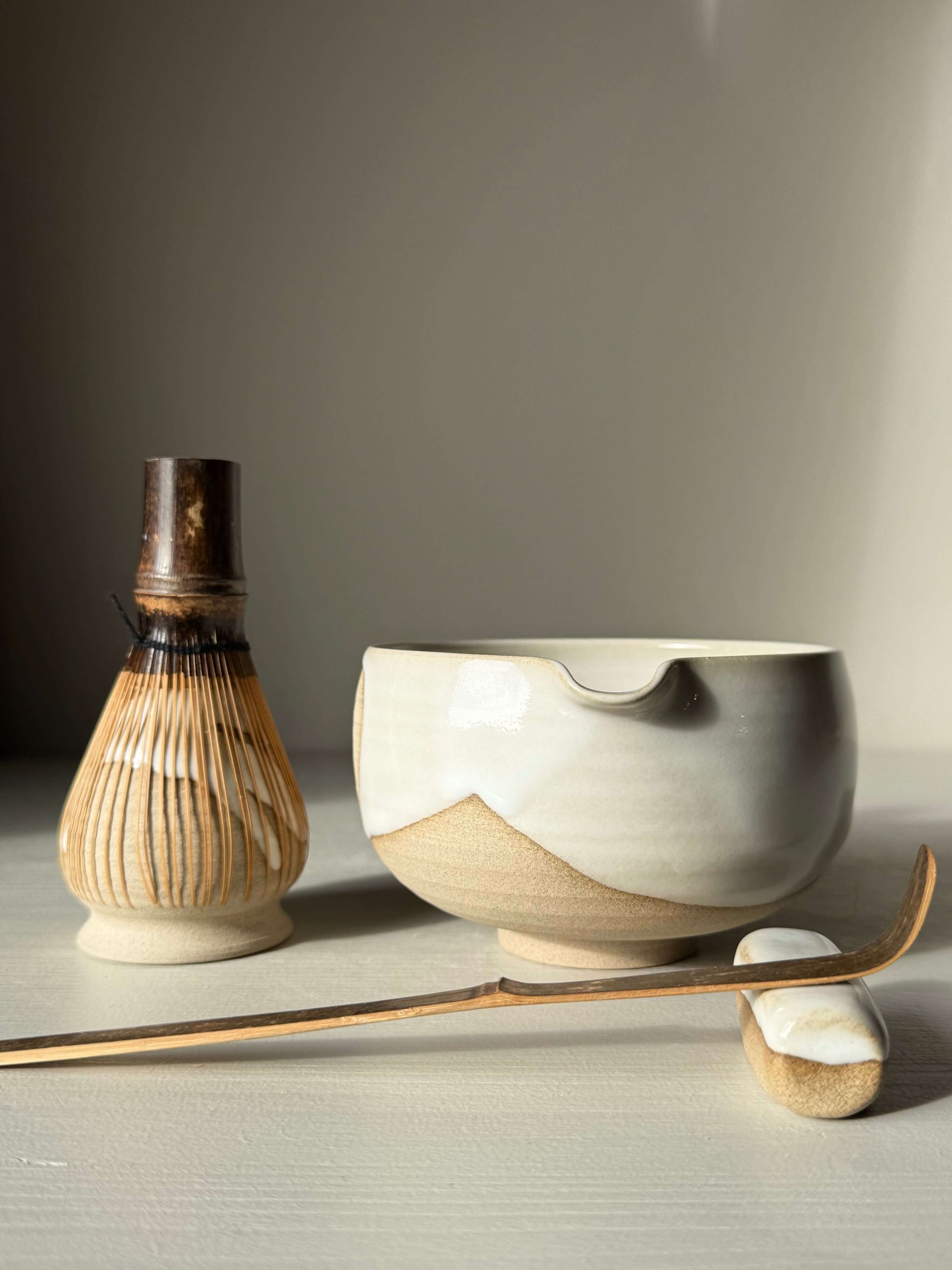 Matcha Bowl with Spout – Yuki #04, handmade ceramic, with toffee clay and white glaze, part of the Yuki Series, wheel-thrown and unique.