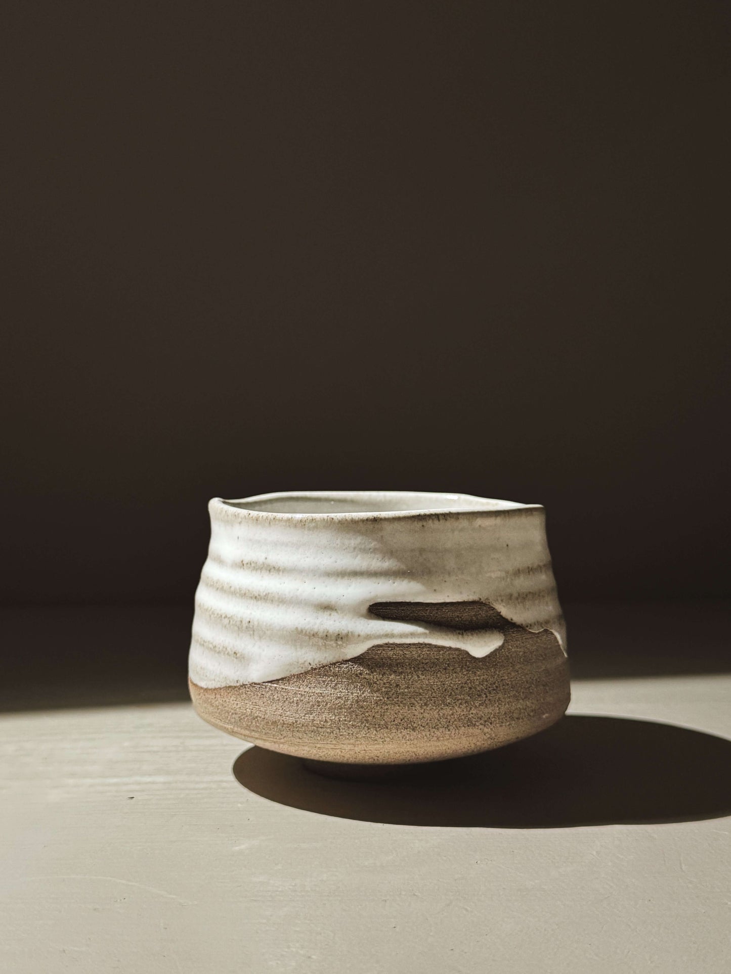 Matcha Bowl – Yuki Ash #03 with ash-grey clay and glossy white glaze, showcasing natural curves and glaze movement.
