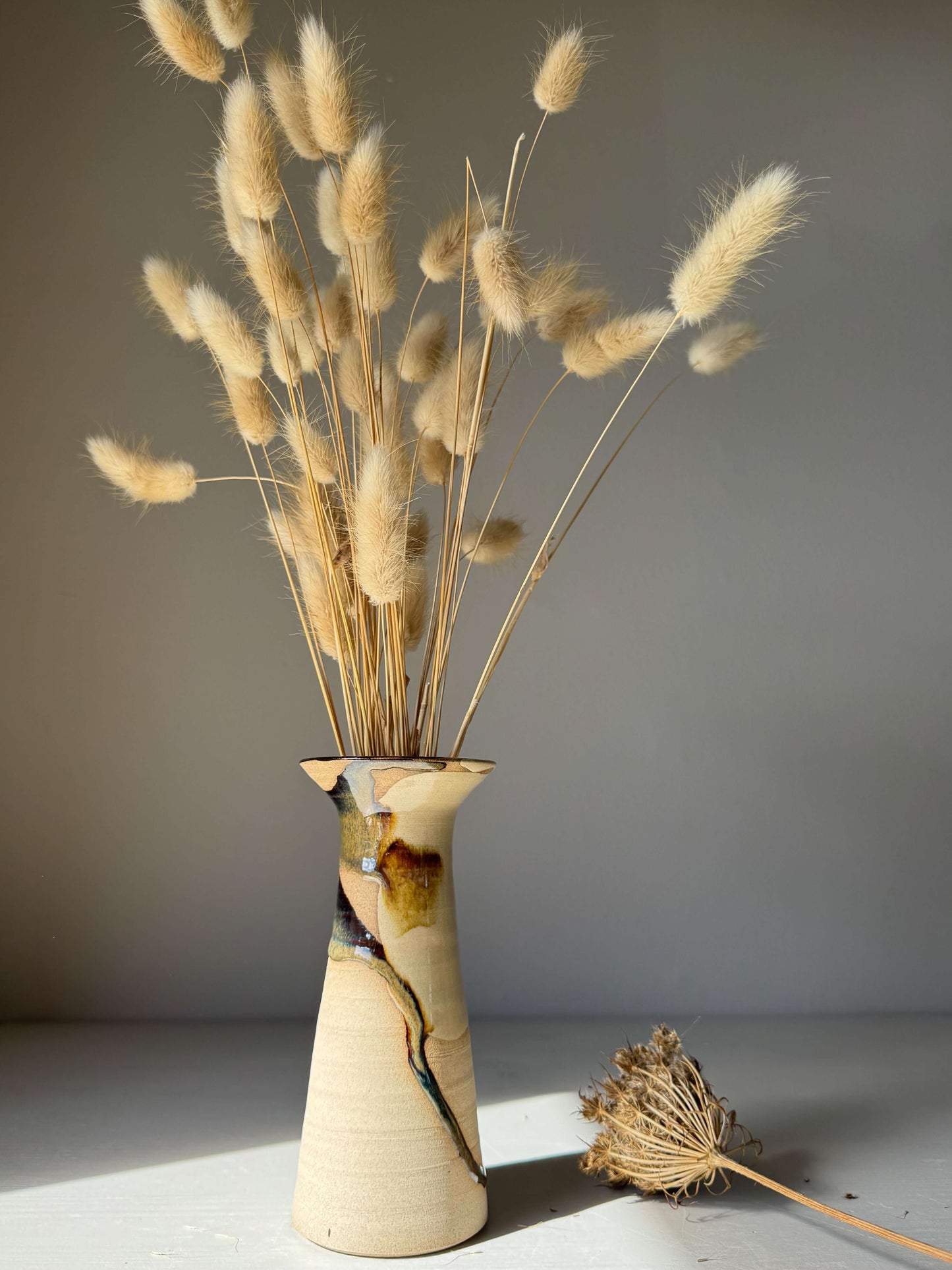 Medium Vase – Inyo Series #03 handmade ceramic vase with dried flowers, showcasing unique glaze and sculptural silhouette.
