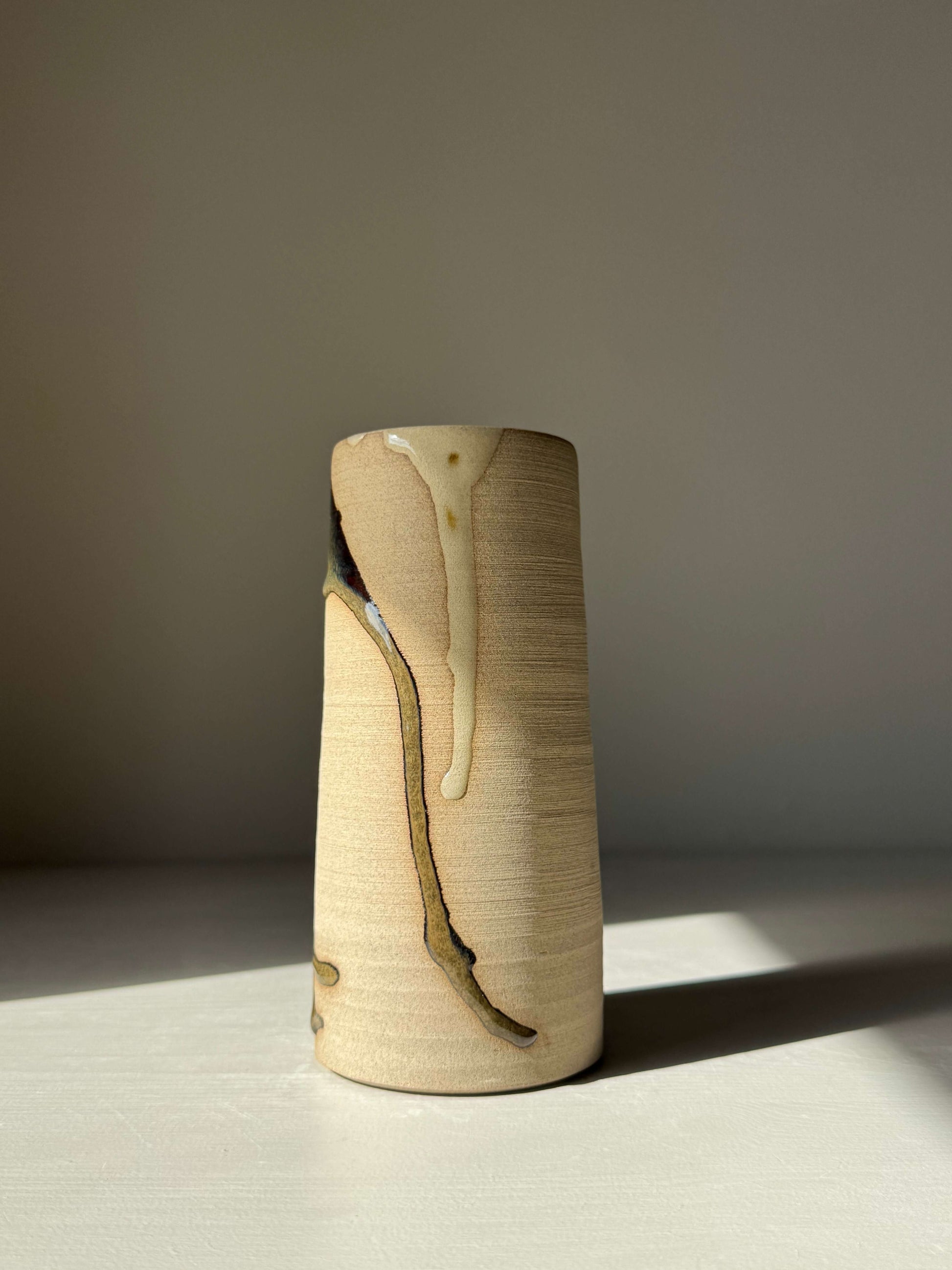 Medium Vase - Inyo Series, handmade ceramic with flowing glaze and raw texture, tall cylinder shape, perfect as a luxurious decor piece.