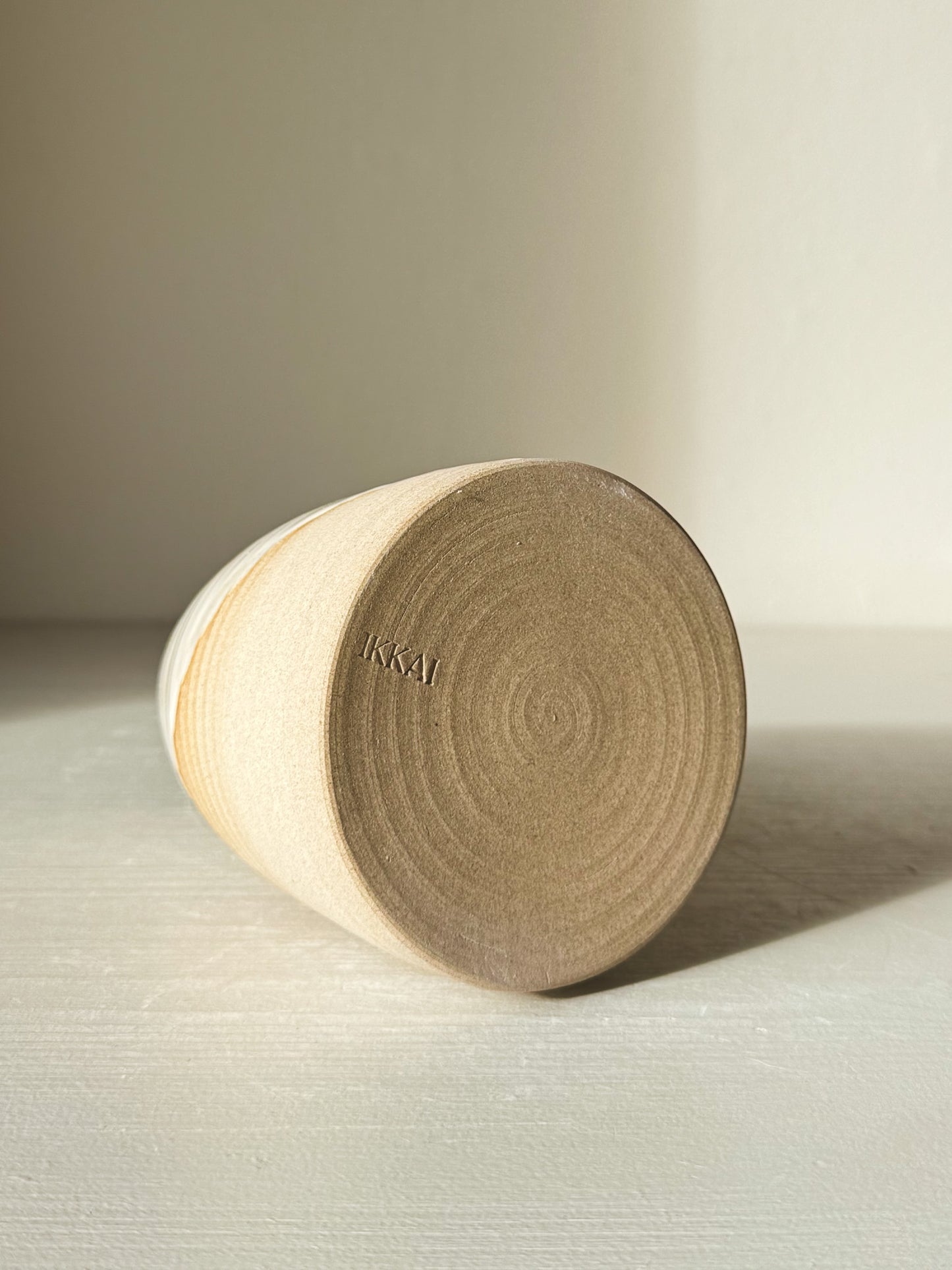 Medium Vase – Yuki #03 showing matte raw clay base with subtle texture on a flat surface.