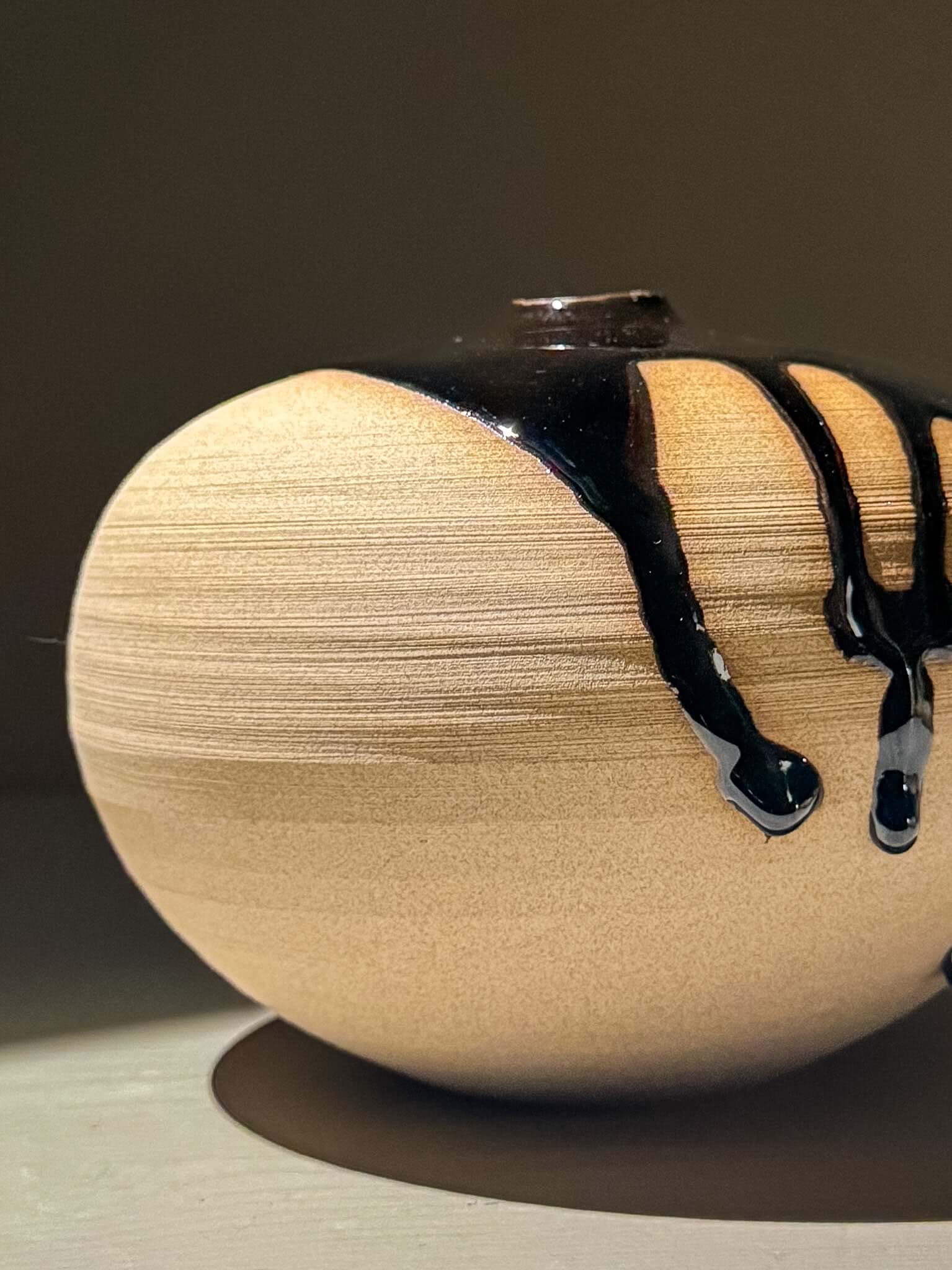 Orb Vase – Kuro #01, a unique Japanese handmade ceramic orb vase with natural glaze movement.