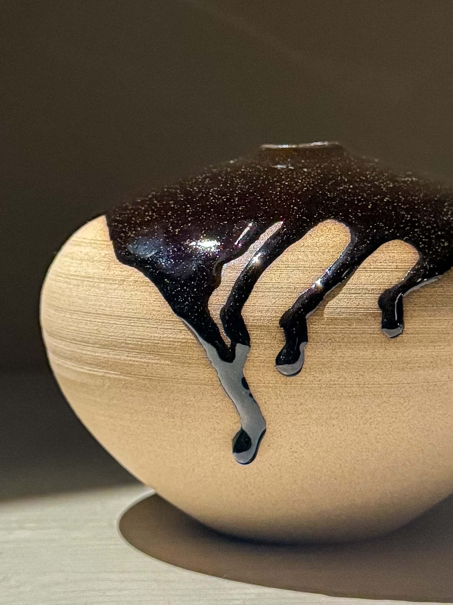 Orb Vase – Kuro #02 showcasing unique glaze drips on a handmade ceramic surface.