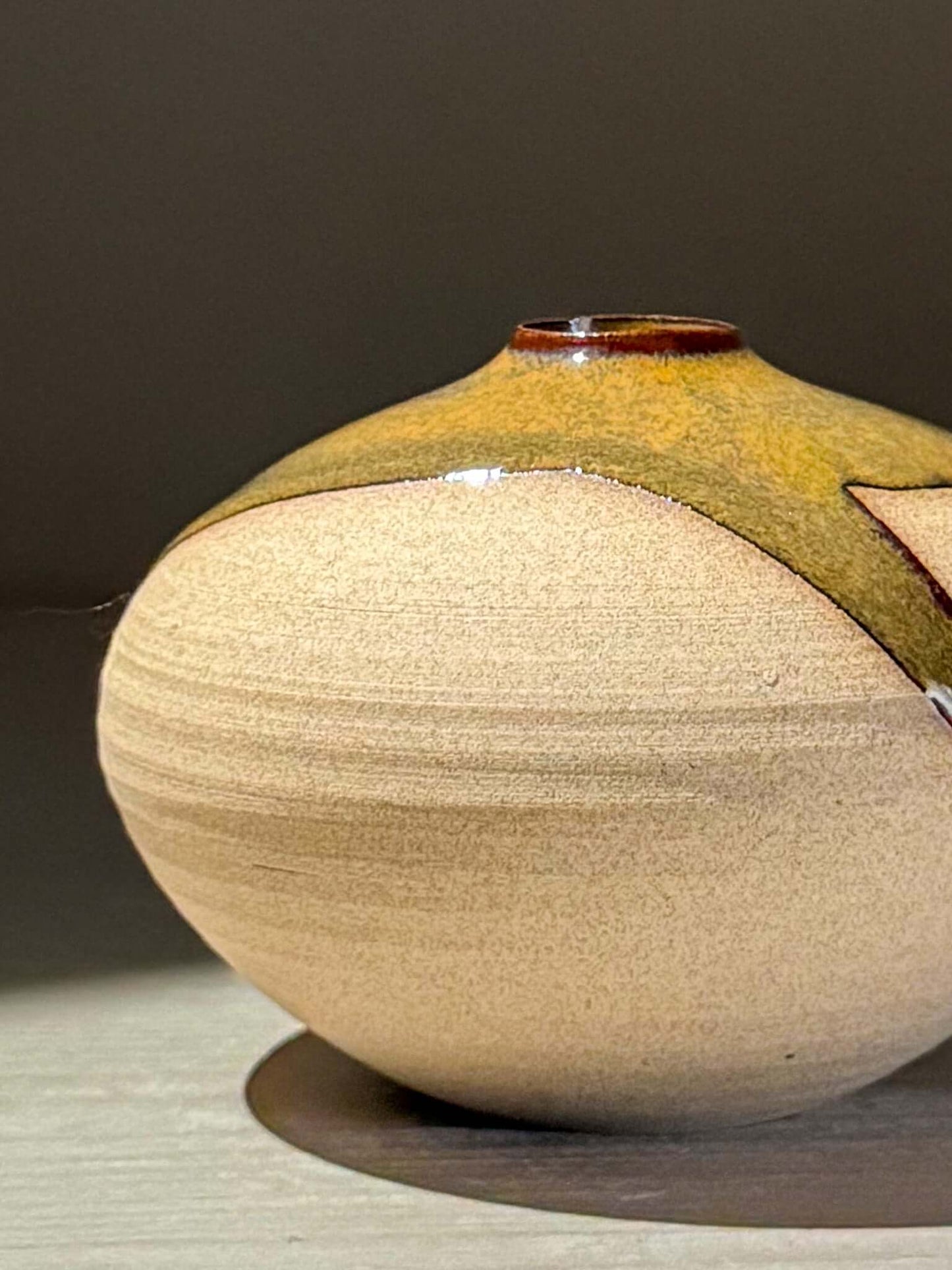 Orb Vase – Tenmoku #13, handmade ceramics with unique glaze patterns and calm, sculptural design.