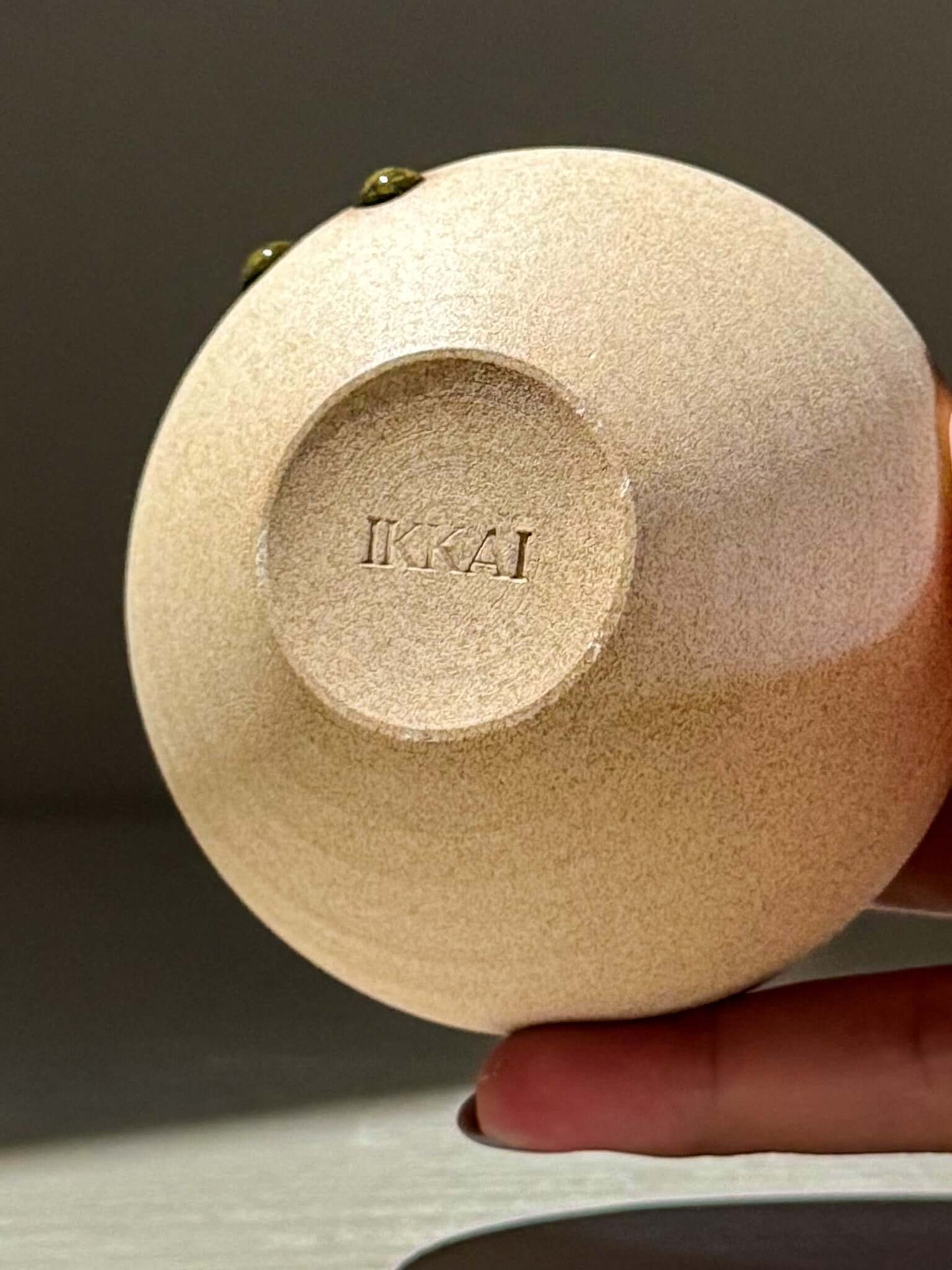 Bottom view of Orb Vase – Tenmoku #15 showing unique glaze and handmade ceramics details.