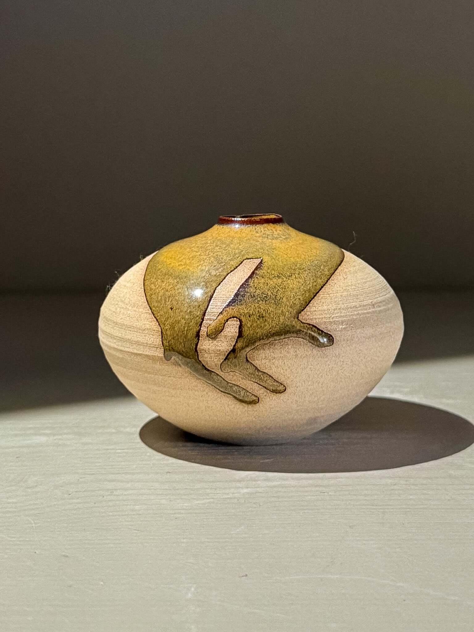 Handmade ceramics Orb Vase – Tenmoku #13 with unique glaze patterns and organic design.