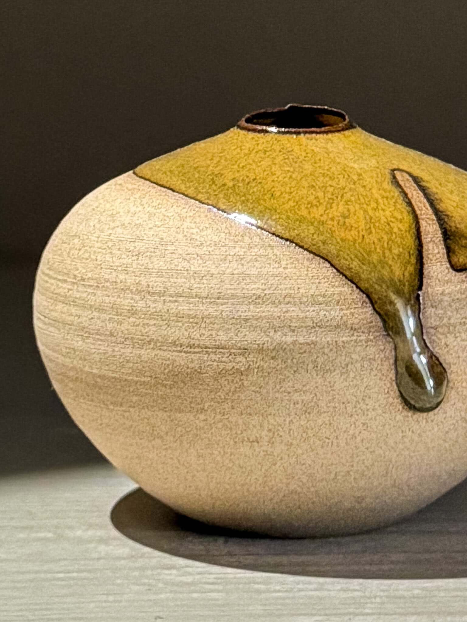 Orb Vase – Tenmoku #15, a handmade ceramics piece showcasing organic glaze patterns and a smooth spherical form.