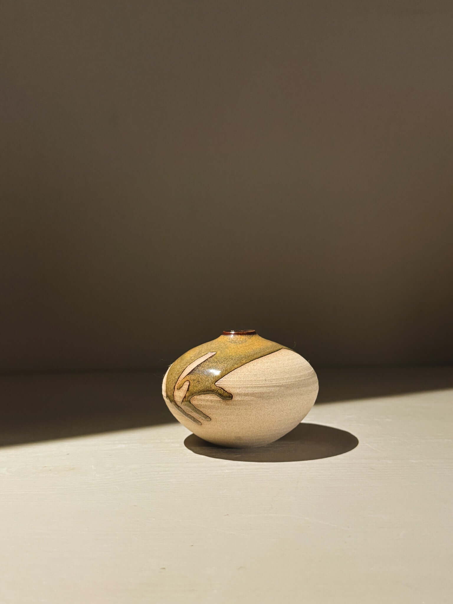 Orb Vase – Tenmoku #13 handmade ceramics with a unique glaze and soft spherical form.