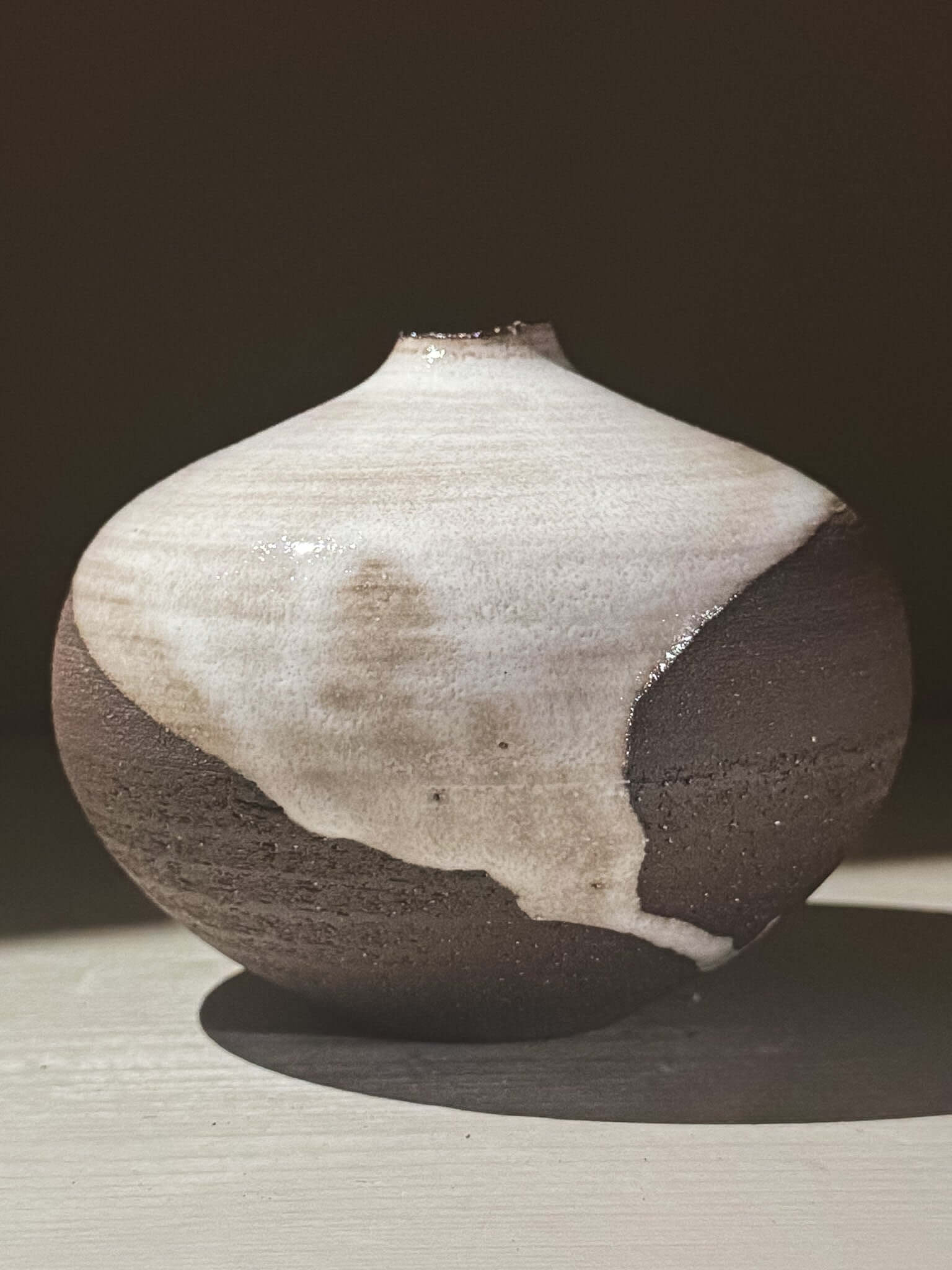 Orb Vase – Yuki Black #03 featuring a unique glaze pattern and soft spherical shape.