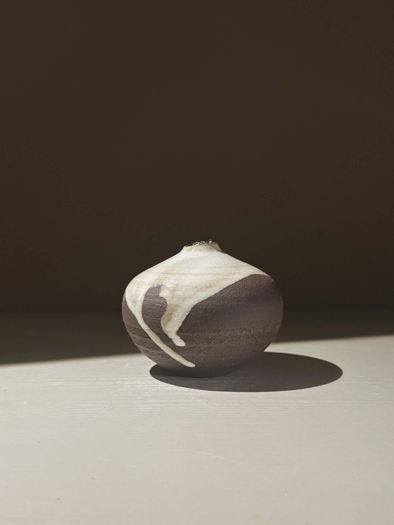 Orb Vase – Yuki Black #09 showcasing unique glaze patterns and rounded design, perfect for home decor.
