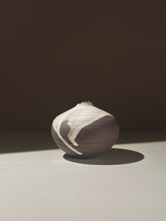 Orb Vase – Yuki Black #09 showcasing unique glaze patterns and rounded design, perfect for home decor.