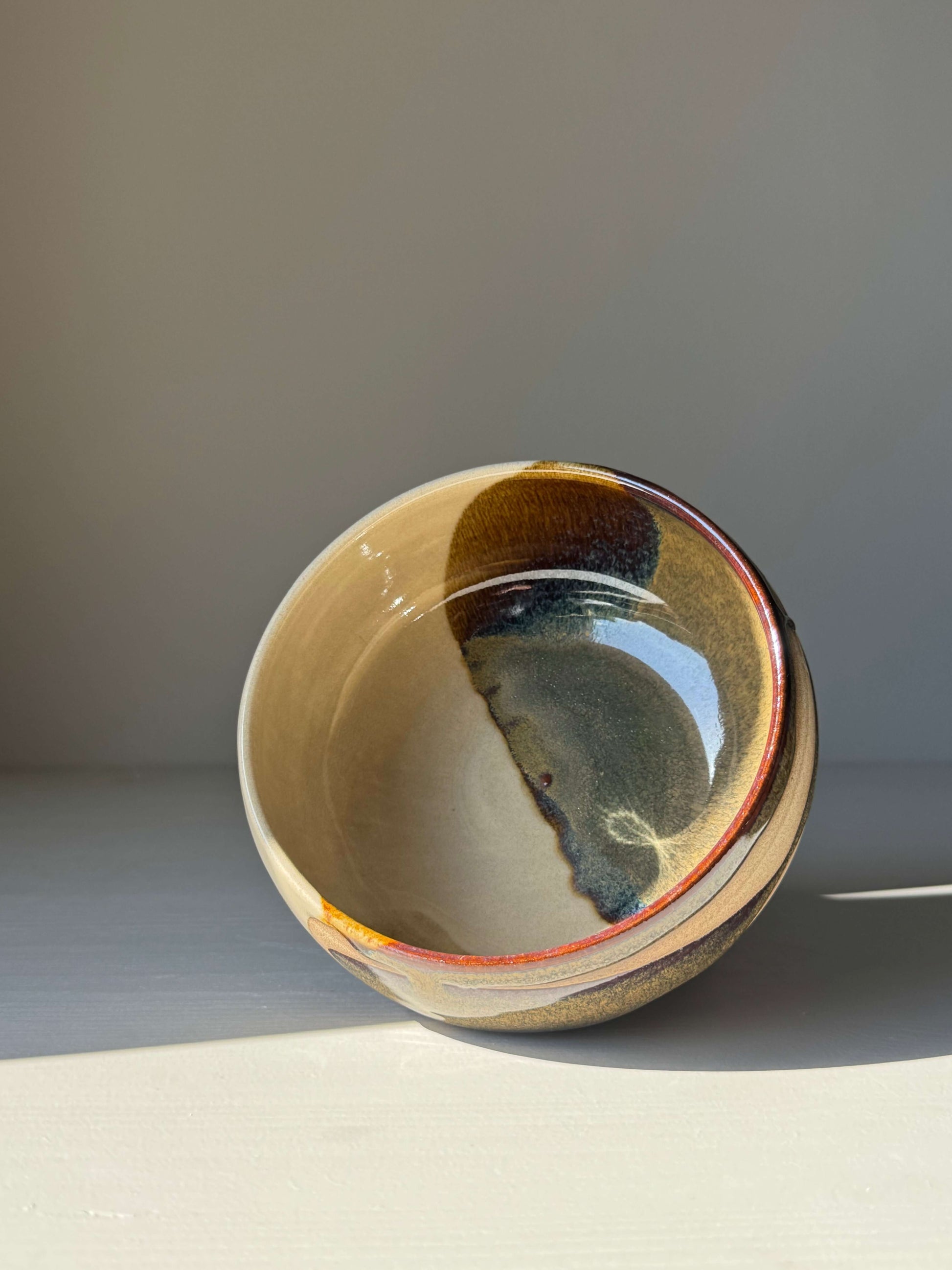 Rounded Breakfast Bowl – Inyo, handmade ceramic bowl with toffee clay and tenmoku glaze, perfect for granola, soup, or rice.