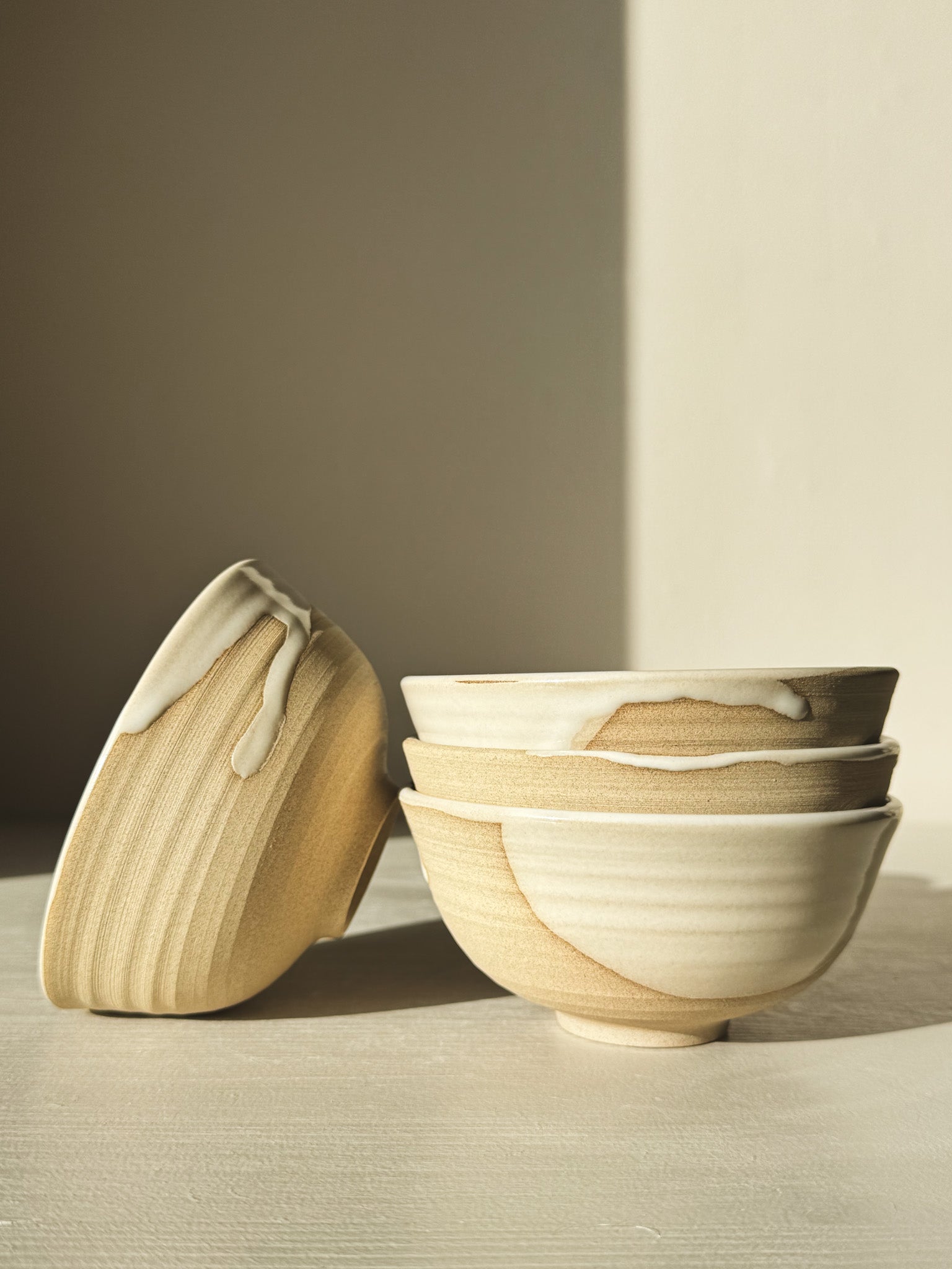 Set of handcrafted Small Bowl - Yuki with white glaze on warm clay, showcasing organic lines and unique design.
