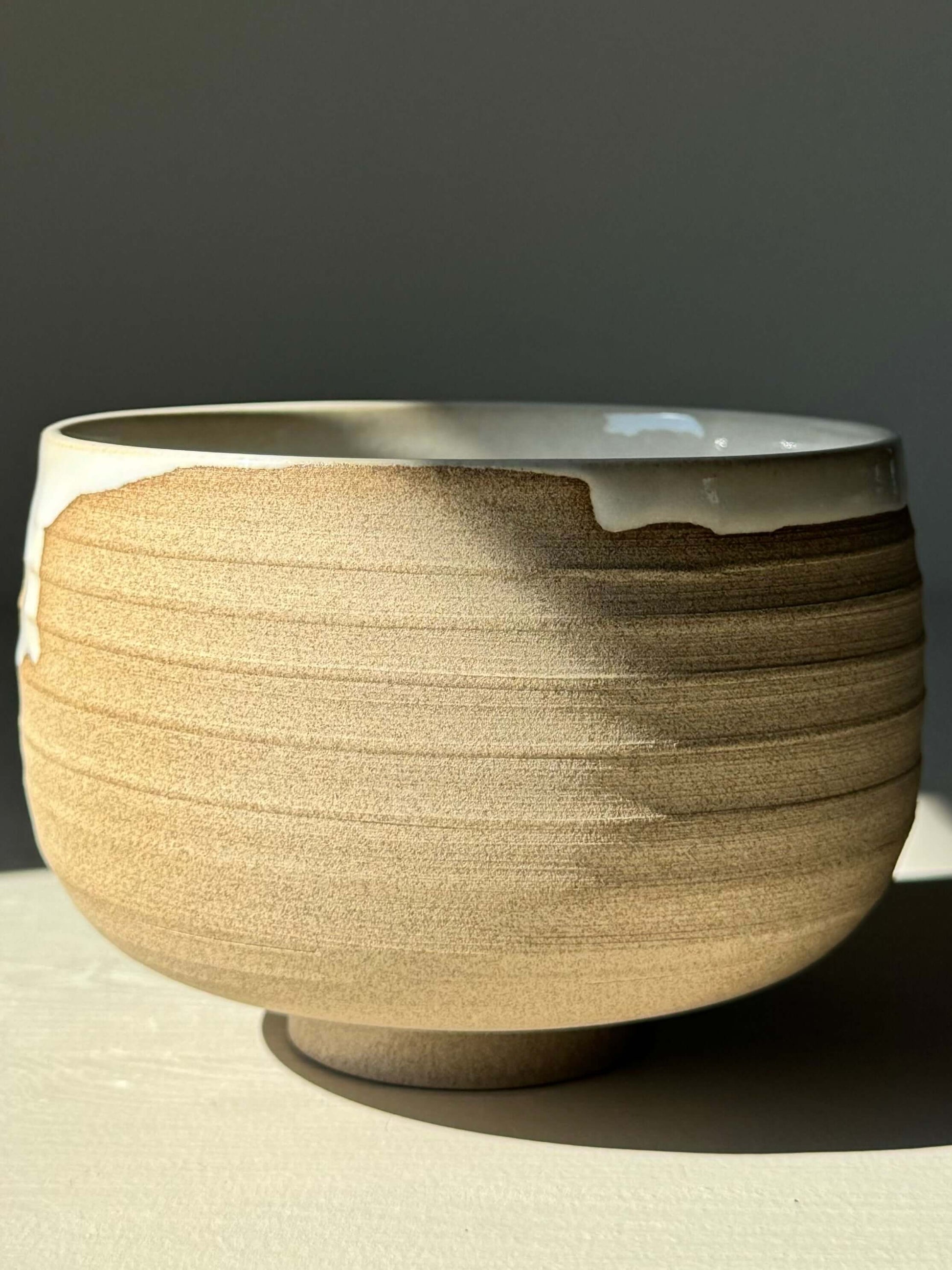 Alt Tag: Handmade Matcha bowl from Yuki Series #06, featuring toffee clay and glossy white glaze, perfect for a calming daily ritual.