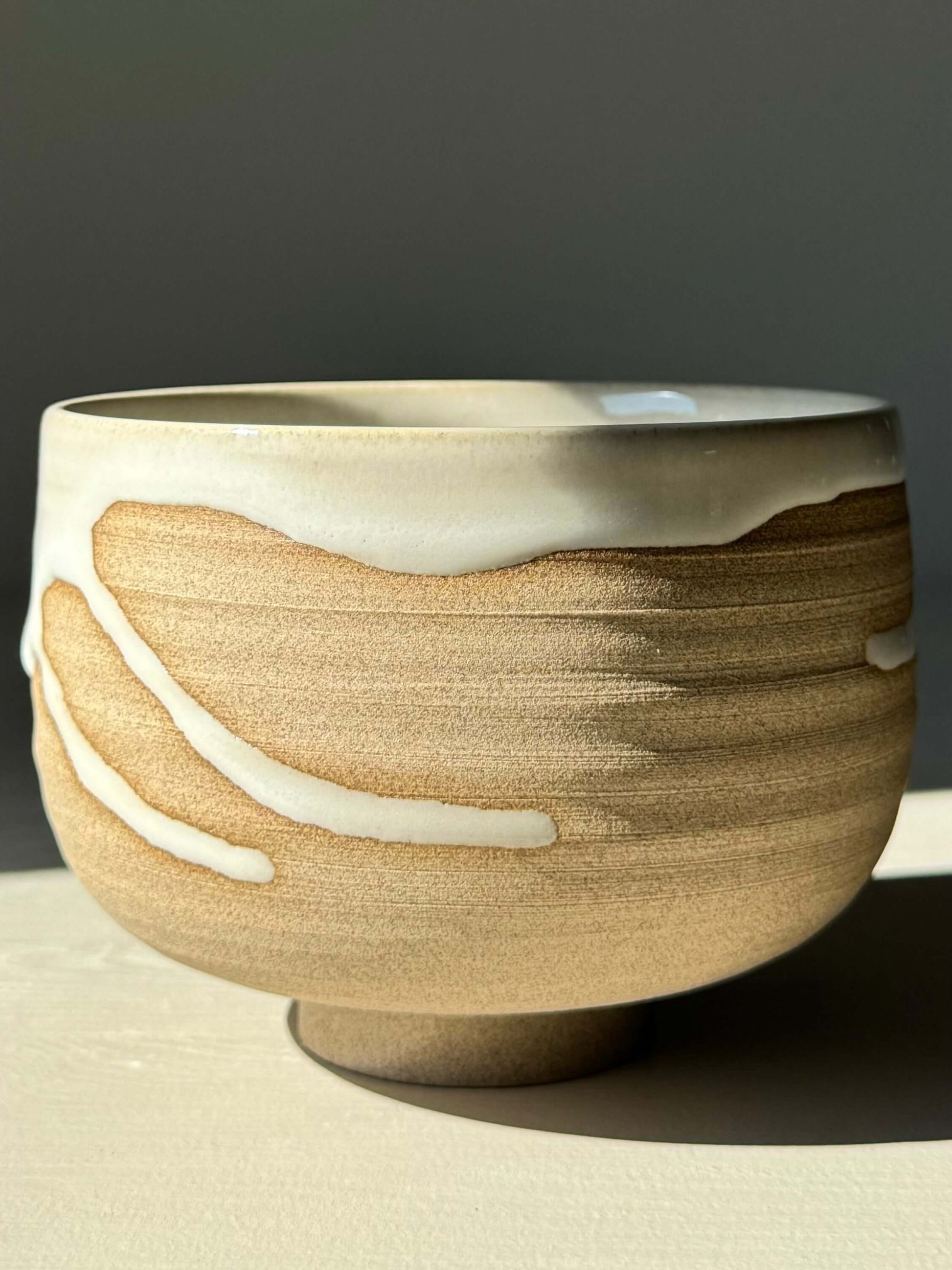 Handmade Matcha bowl from Yuki Series with toffee clay and white glaze, bringing beauty and calm to rituals.