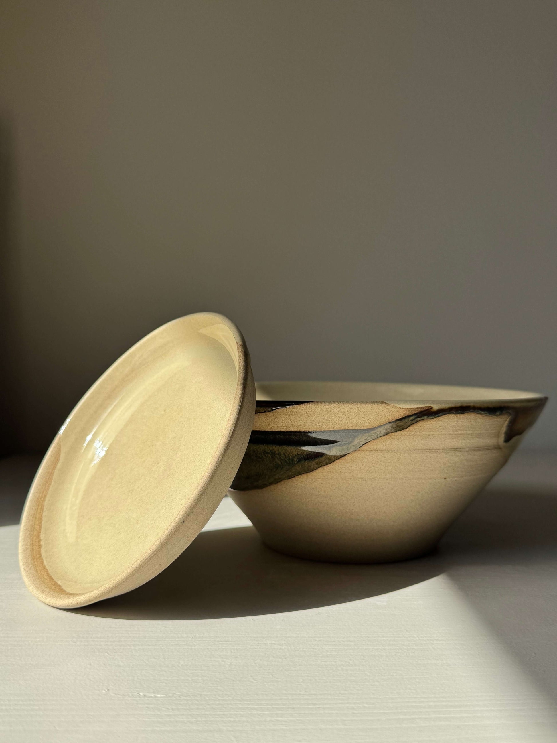Berry Bowl - Inyo Series handmade ceramic bowl with drip plate in tenmoku brown glaze, ideal for rinsing fruit and herbs.