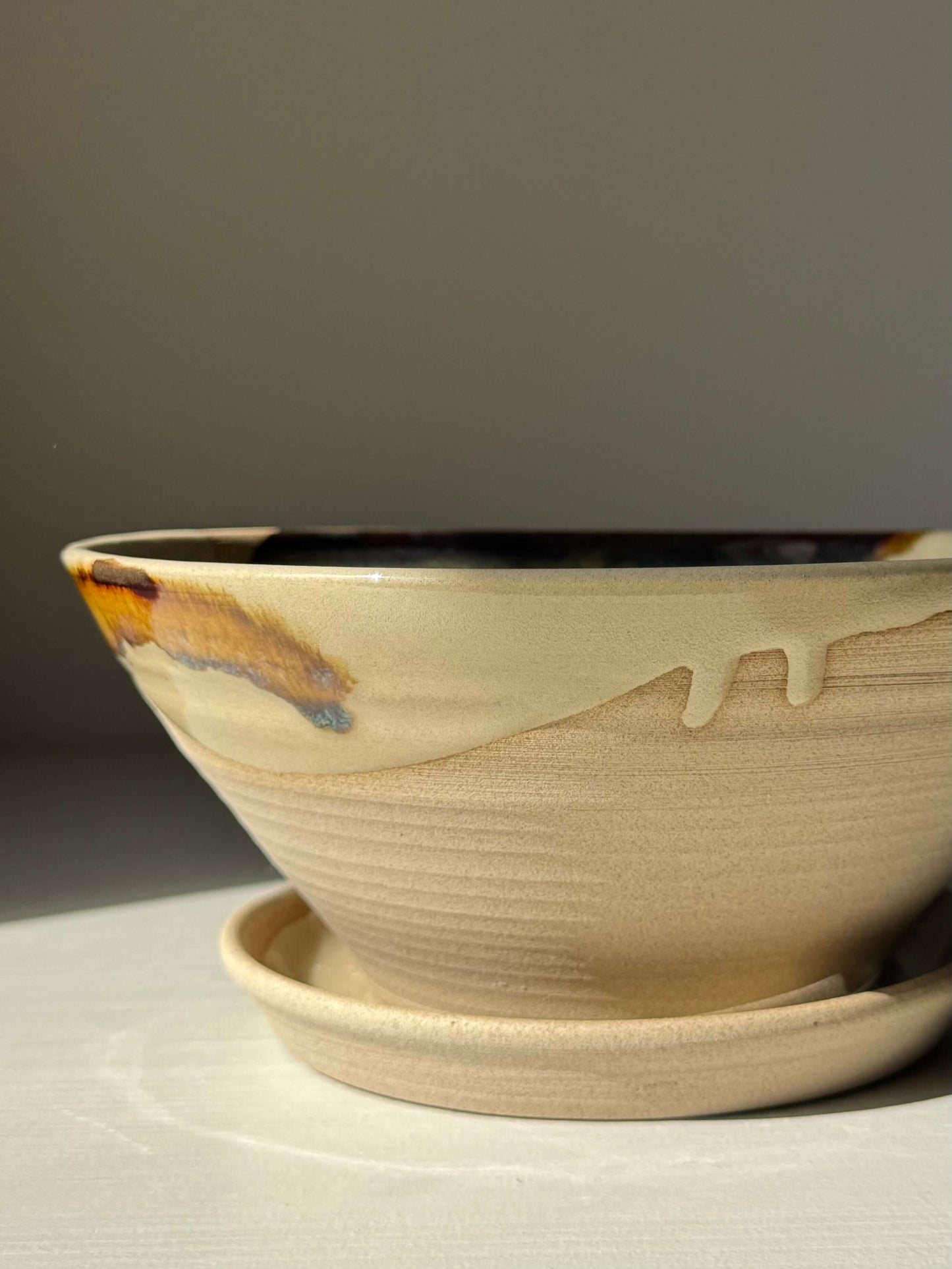 Handmade ceramic Berry Bowl - Inyo Series with tenmoku brown and golden glaze, featuring a matching drip plate for easy use.