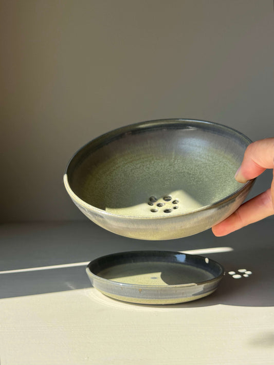 Handmade ceramic Berry Bowl - Satin Blue with drainage holes and matching drip plate, finished in a satin glaze with blue-green hues.
