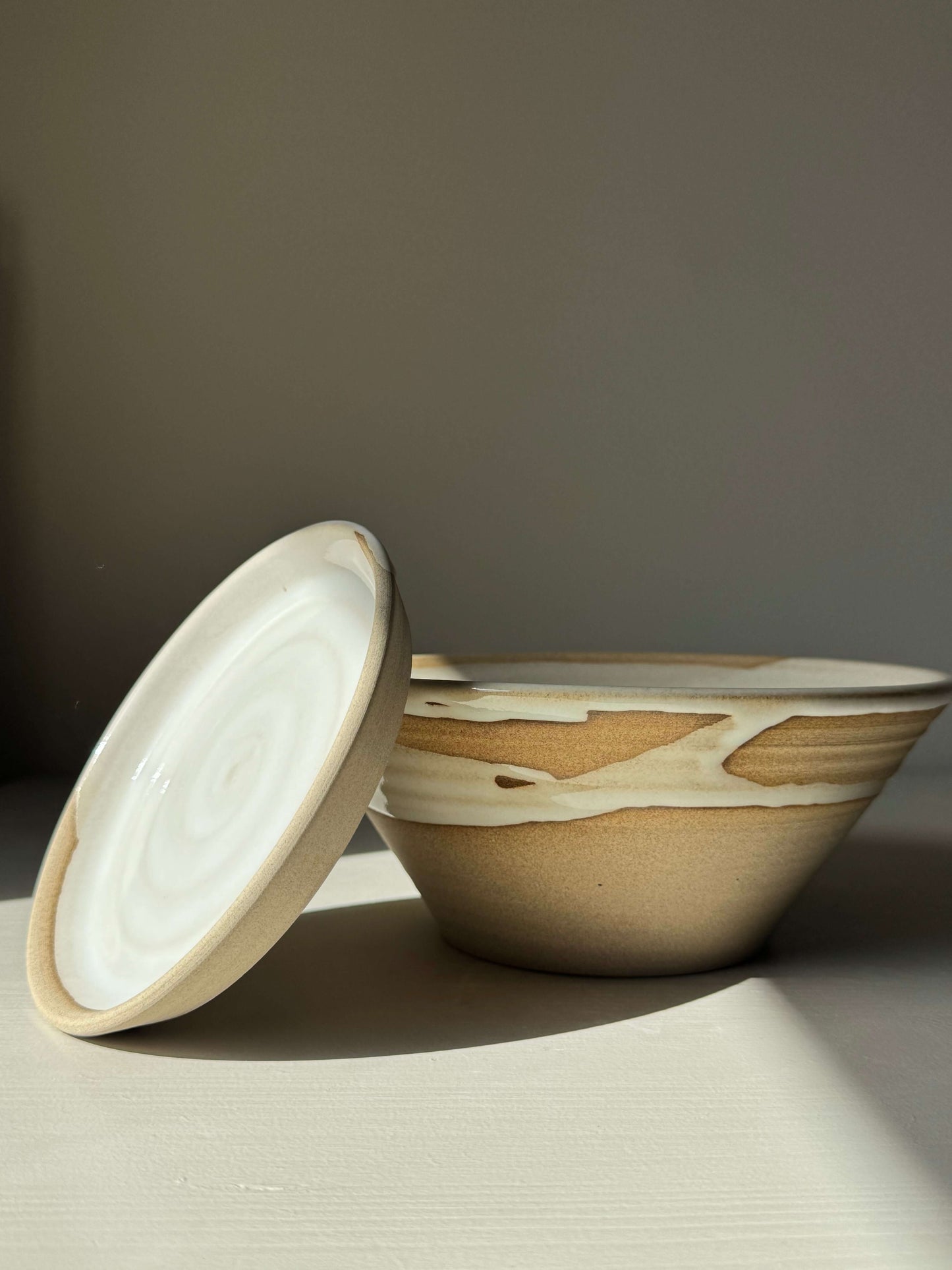 Handmade ceramic Berry Bowl - Yuki Series with soft white glaze on warm toffee clay and matching drip plate.